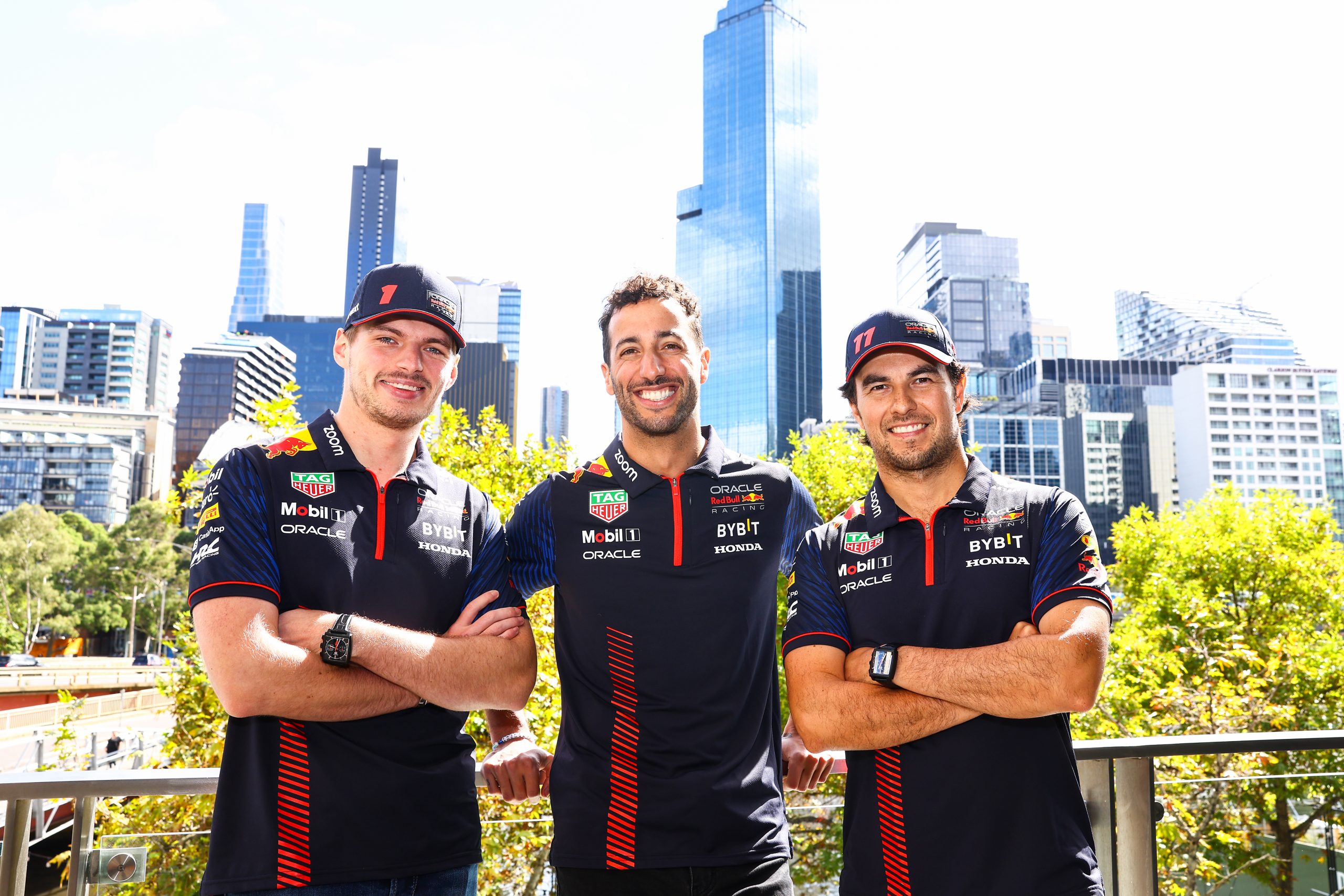 Red Bull's Max Verstappen (left) and Sergio Perez (right) with reserve driver Daniel Ricciardo.