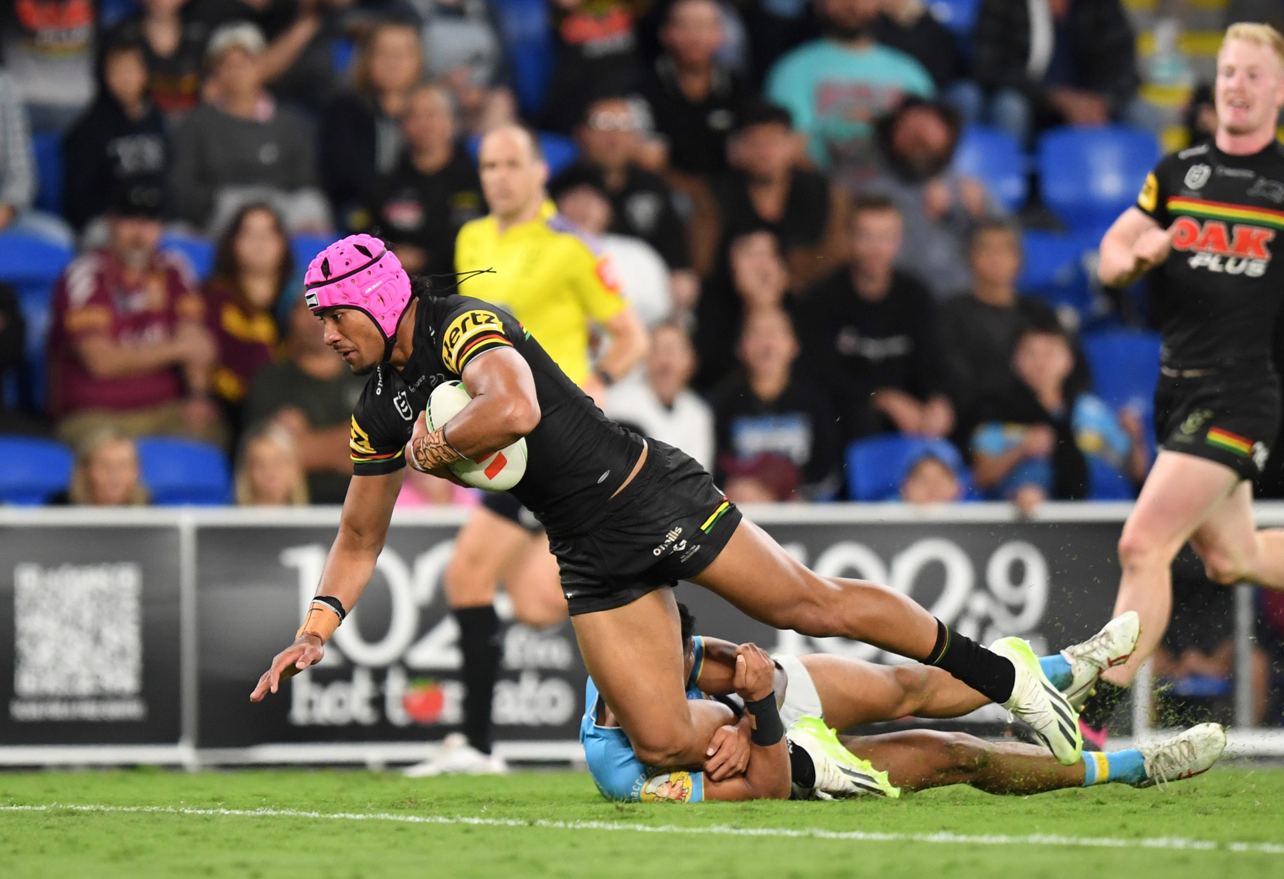 Stephen Crichton of the Panthers scores against the Titans in round 25.