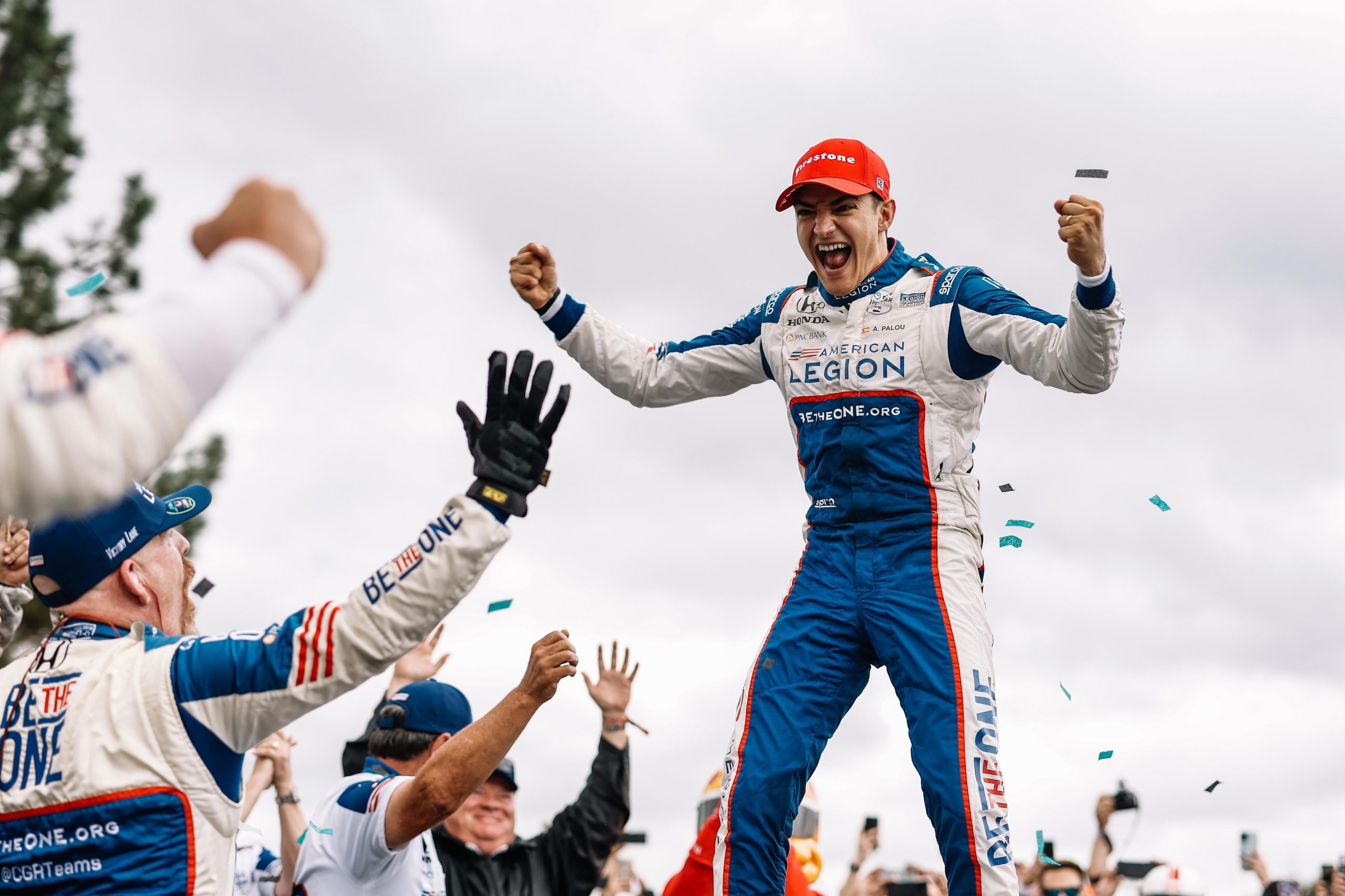 Alex Palou celebrates winning the IndyCar Series title with his Chip Ganassi Racing team.
