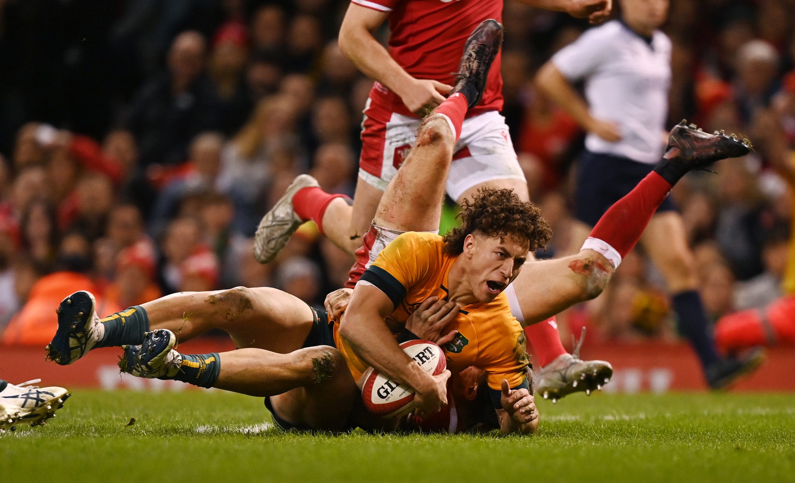 Mark Nawaqanitawase of Australia goes over to score at Principality Stadium.