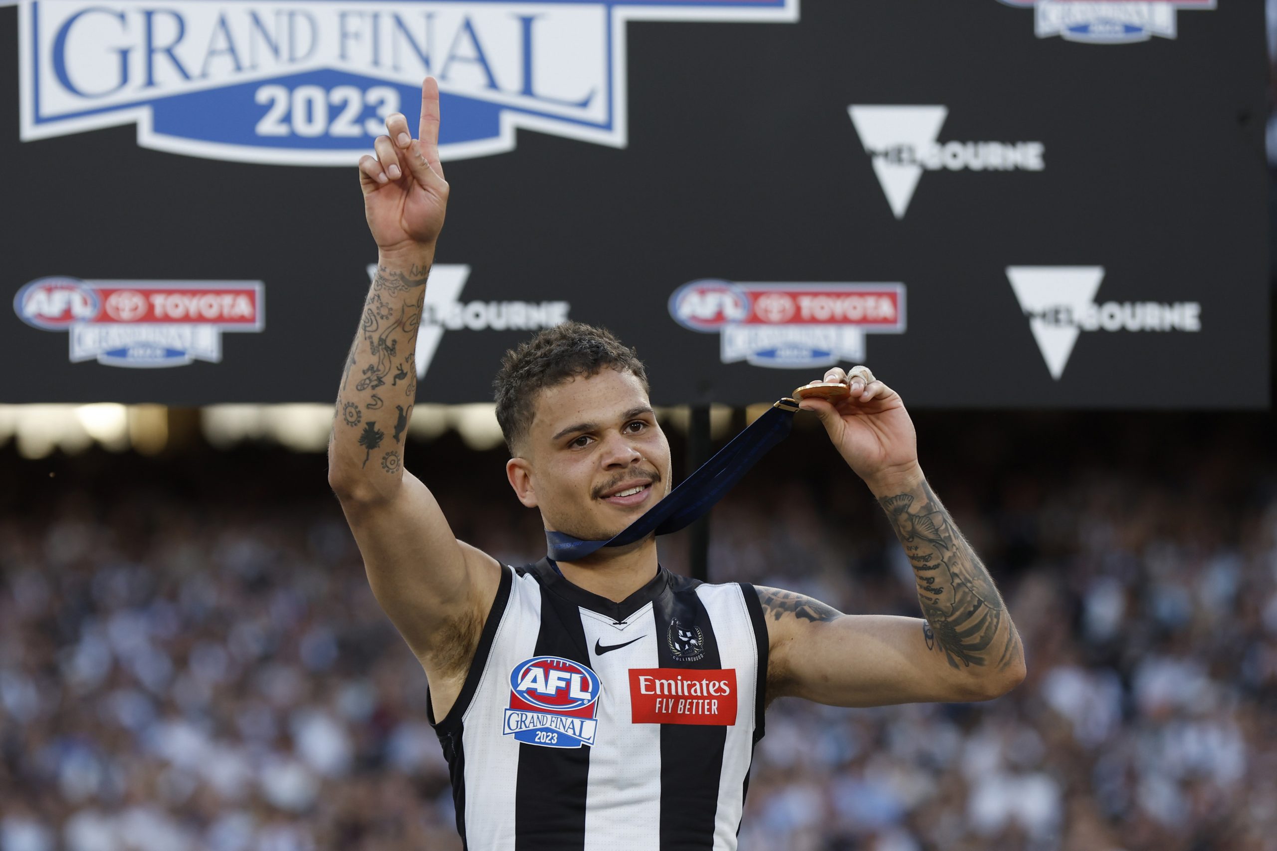 MELBOURNE, AUSTRALIA - SEPTEMBER 30: Bobby Hill of the Magpies celebrates after the 2023 AFL Grand Final match between Collingwood Magpies and Brisbane Lions at Melbourne Cricket Ground, on September 30, 2023, in Melbourne, Australia. (Photo by Darrian Traynor/AFL Photos/via Getty Images)