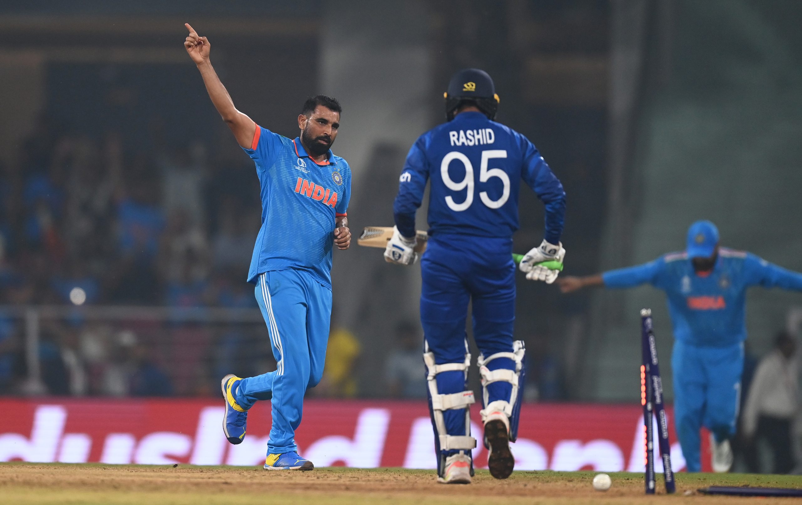 Mohammed Shami of India celebrates the wicket of Adil Rashid of England.