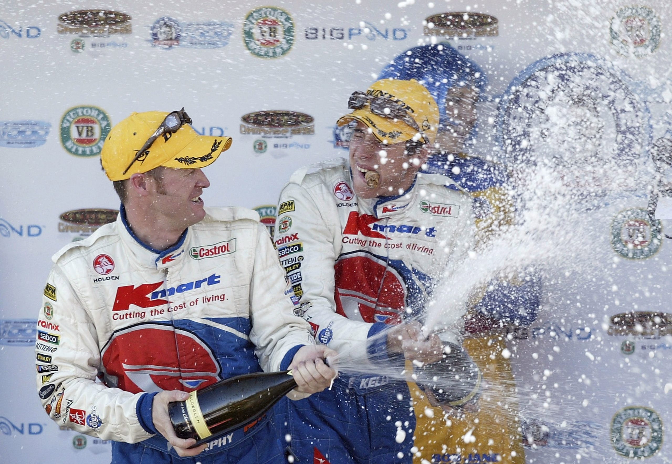 Greg Murphy and co driver Rick Kelly of the KMart Racing Team celebrate their win in the Bob Jane Bathurst 1000, which is round 10 of the V8 Supercar Championship October 12, 2003 at the Mount Panorama Circuit, Bathurst, Australia. (Photo by Robert Cianflone/Getty Images)