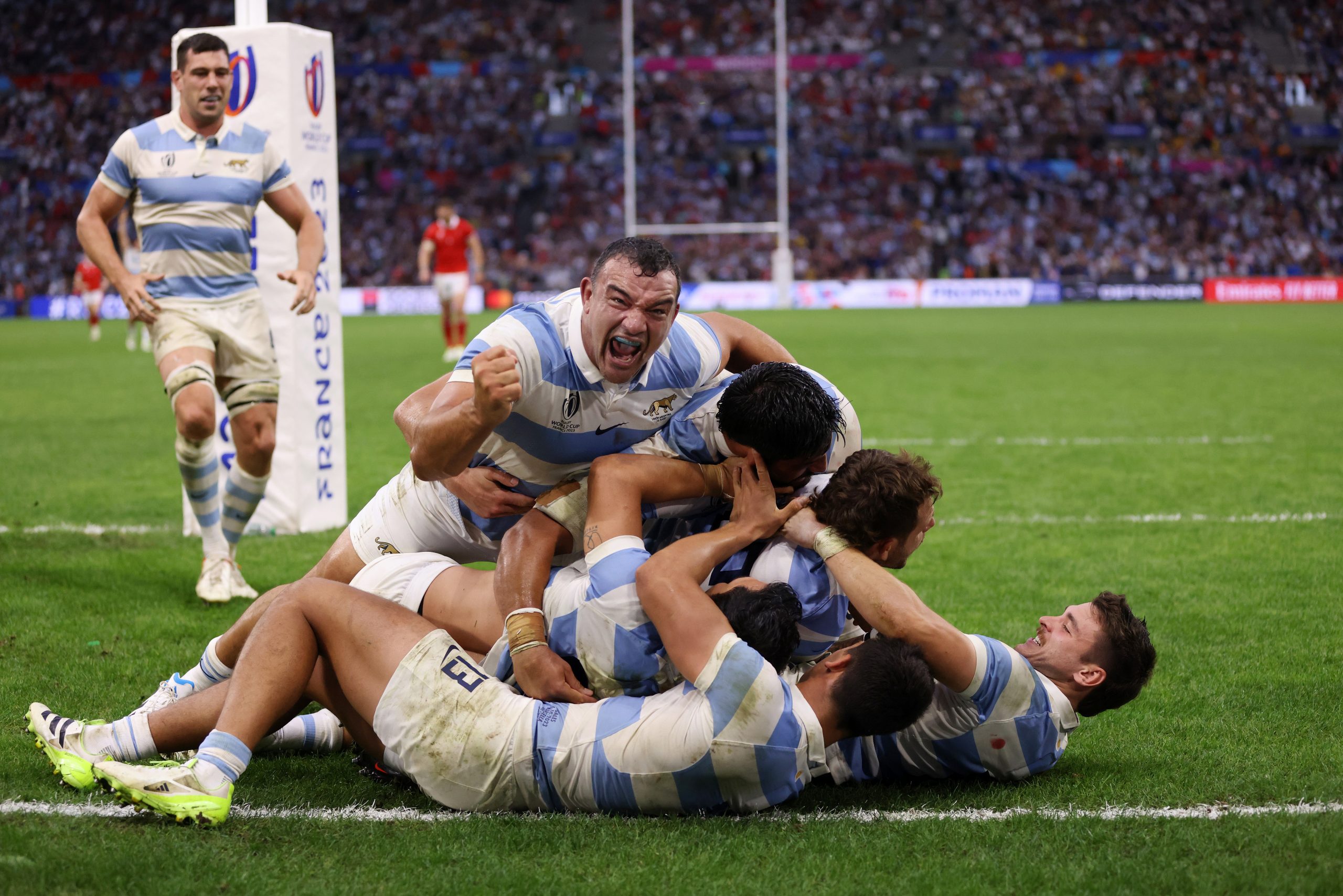 Nicolas Sanchez of Argentina celebrates with teammates after scoring.