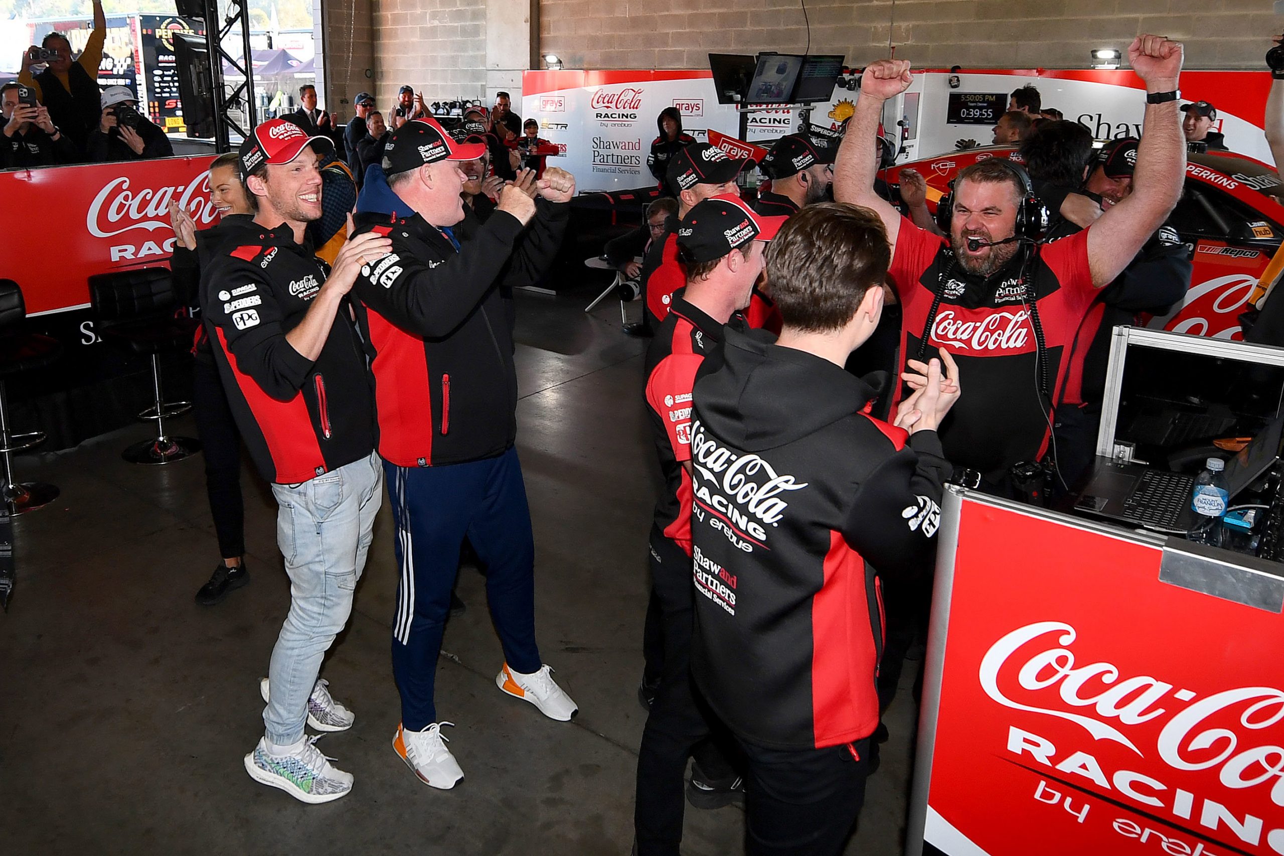 Erebus Motorsport team members celebrate after Brodie Kostecki, driver of the Erebus Motorsport Chevrolet Camaro claimed pole position during the Bathurst 1000, part of the 2023 Supercars Championship Series at Mount Panorama on October 07, 2023 in Bathurst, Australia. (Photo by Morgan Hancock/Getty Images)