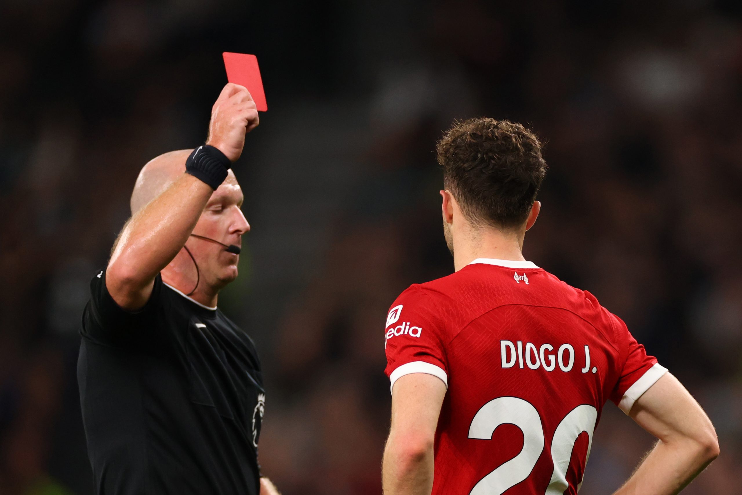 Diogo Jota of Liverpool is shown a red card by Referee Simon Hooper during the Premier League match between Tottenham Hotspur and Liverpool FC at Tottenham Hotspur Stadium on September 30, 2023 in London, England. (Photo by Marc Atkins/Getty Images)