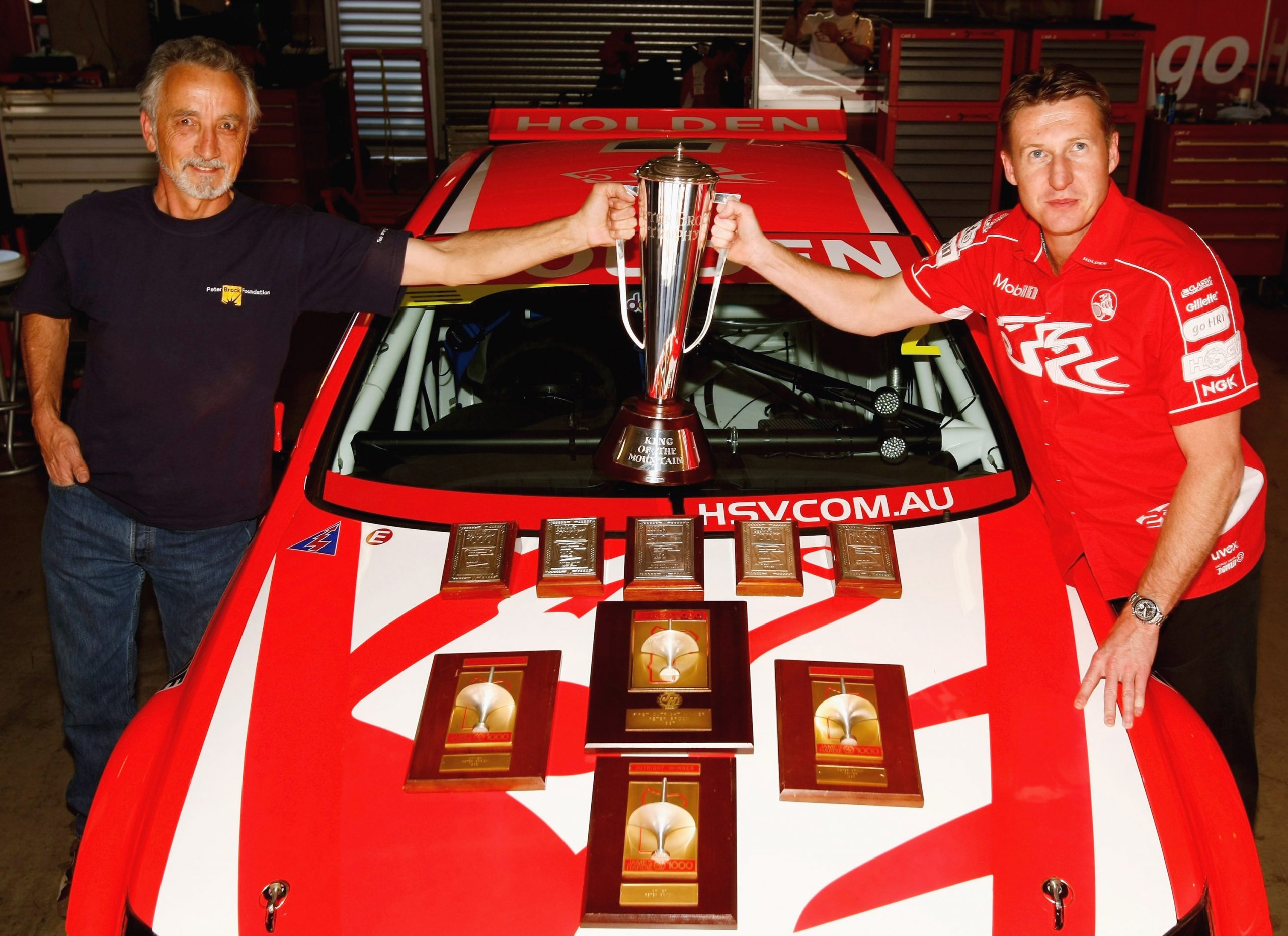 Phil Brock, brother of the late Peter Brock, and Mark Skaife of the Holden Racing Team hold the Peter Brock Trophy, as the nine trophies that the late Peter Brock recieved for his nine Bathurst wins are displayed together for the first time, prior to the Bathurst 1000 V8 Supercars race at the Mount Panorama circuit October 3, 2007 in Bathurst, Australia. 