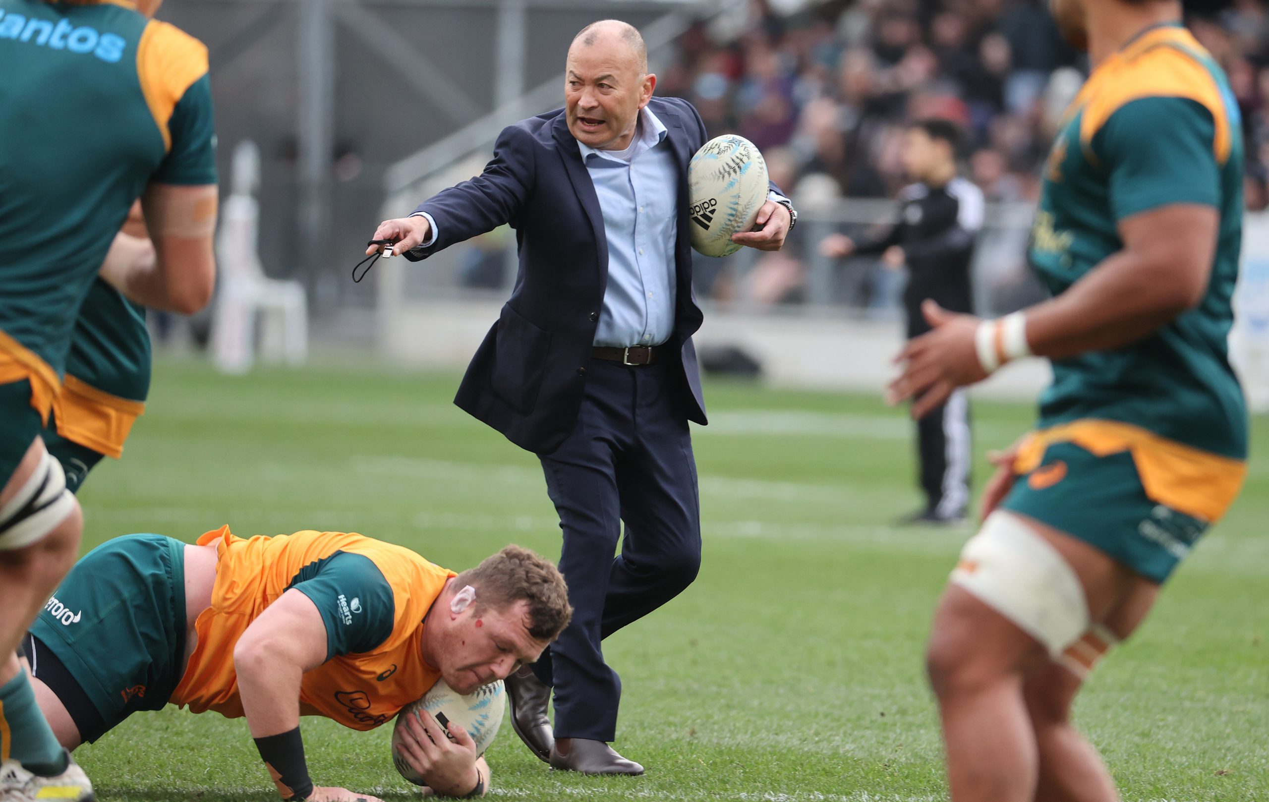 Eddie Jones of Australia gives instructions during warmups.