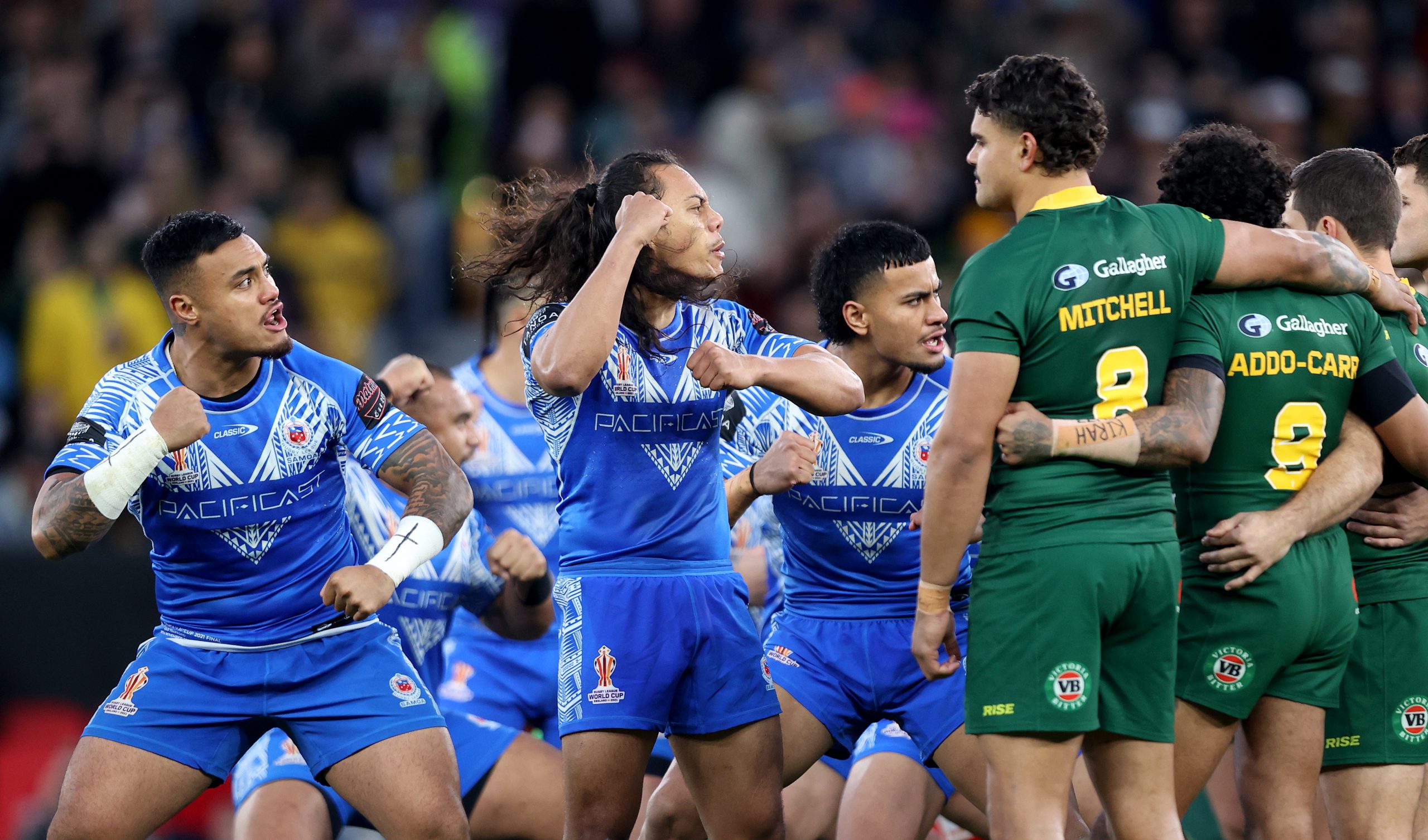 Players of Samoa face off with Latrell Mitchell of Australia during the Siva Tau prior to the Rugby League World Cup Final match between Australia and Samoa at Old Trafford on November 19, 2022 in Manchester, England. (Photo by Naomi Baker/Getty Images)