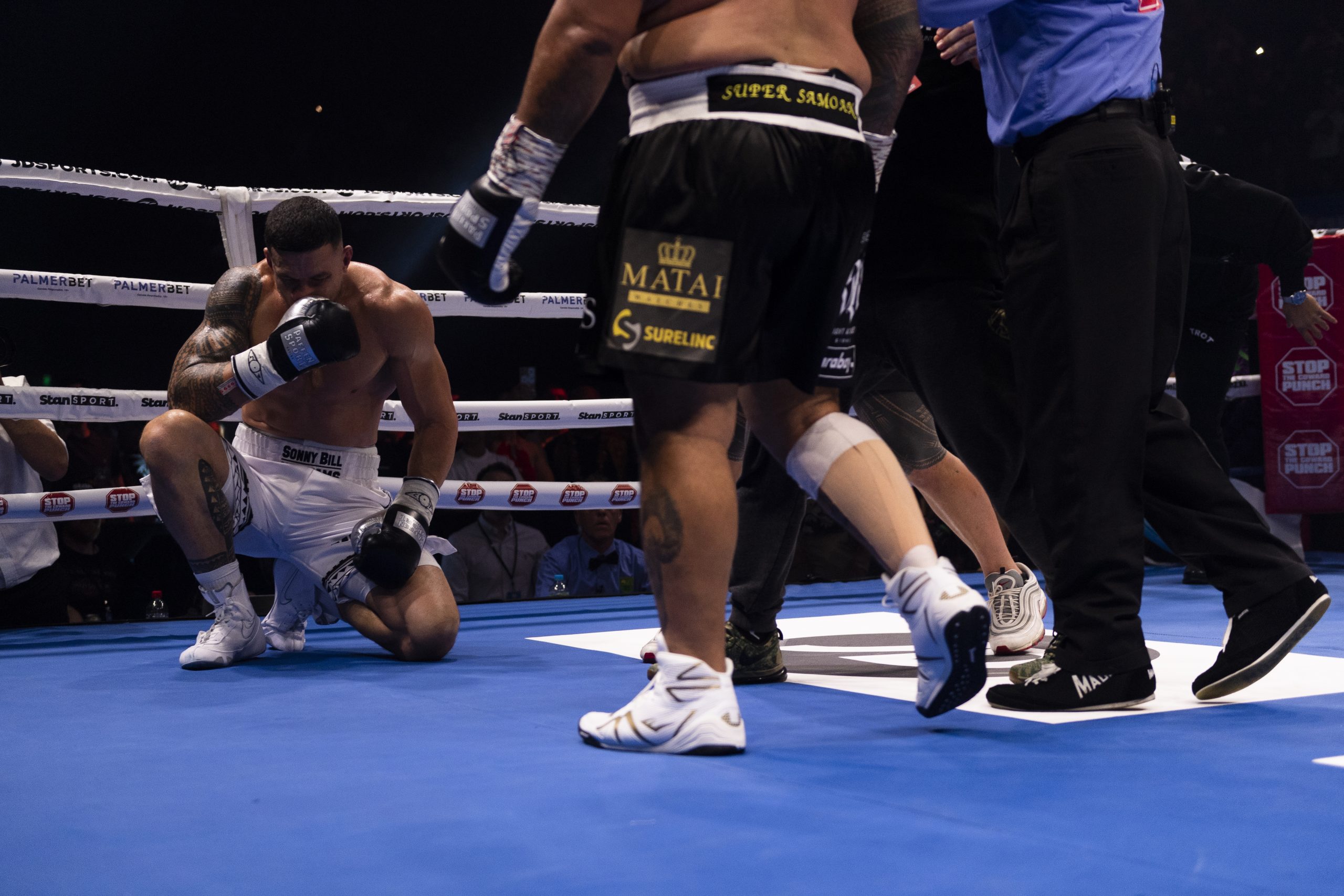 Sonny Bill Williams kneels on the grount after being knocked out by Mark Hunt.