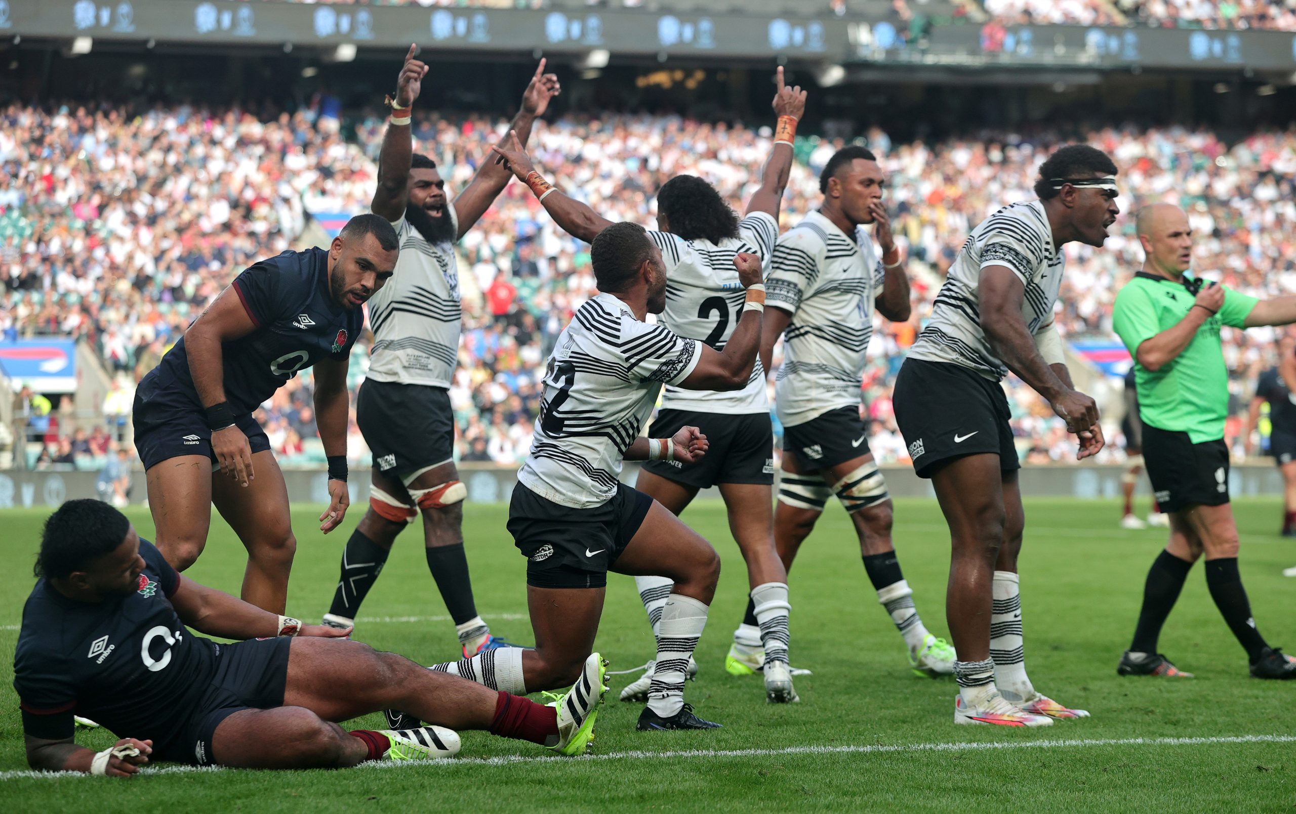 Fiji celebrate their historic victory at the final whistle during against England at Twickenham.