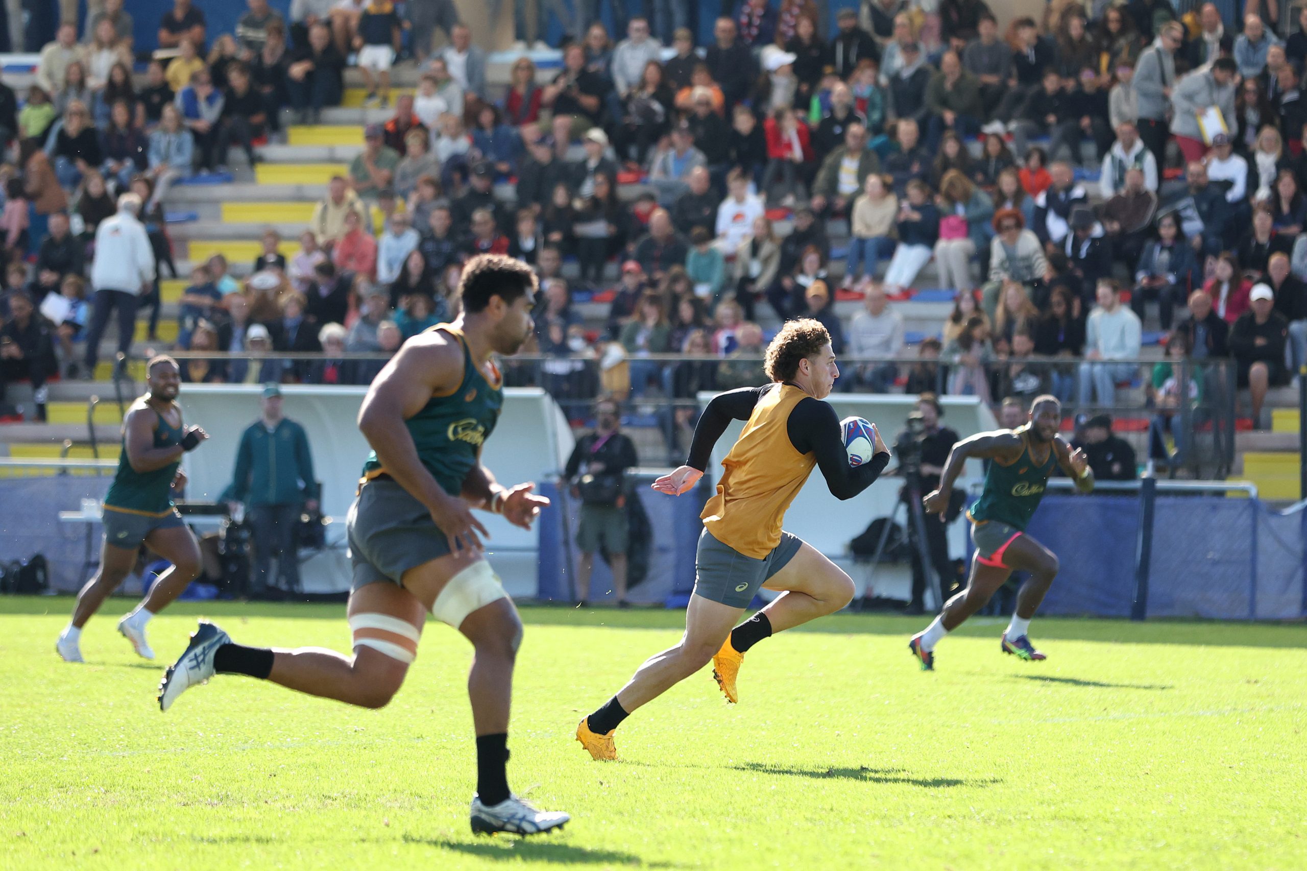 Mark Nawaqanitawase  runs the ball during a Wallabies training session at Stade Roger Baudras.