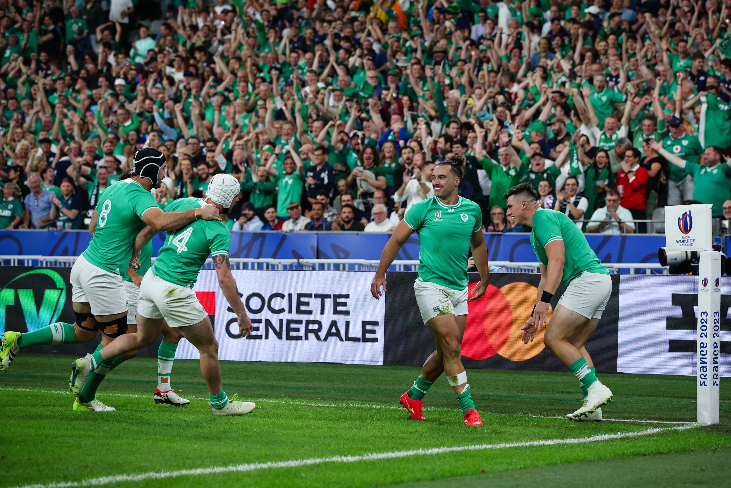 PARIS, FRANCE - OCTOBER 7: James Lowe of Ireland celebrates scoring his sides first try with team mates during the Rugby World Cup France 2023 match between Ireland and Scotland at Stade de France on October 7, 2023 in Paris, France. (Photo by Craig Mercer/MB Media/Getty Images)