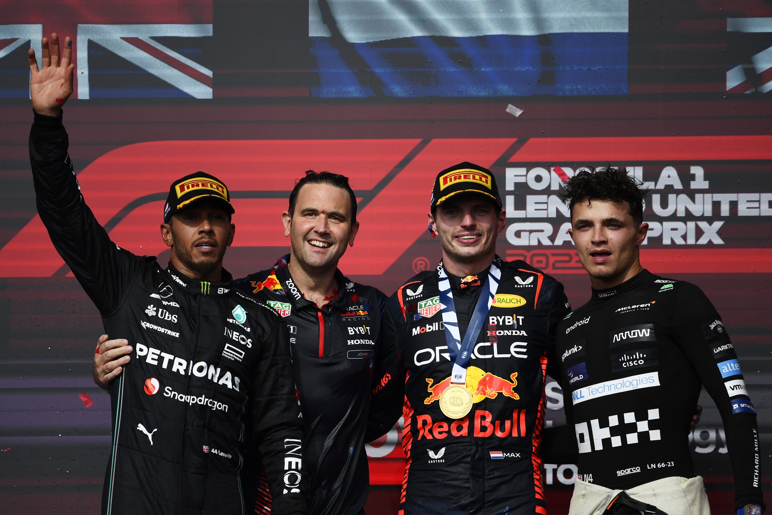 United States Grand Prix winner Max Verstappen (second from right) with Lewis Hamilton (left) and Lando Norris (right).