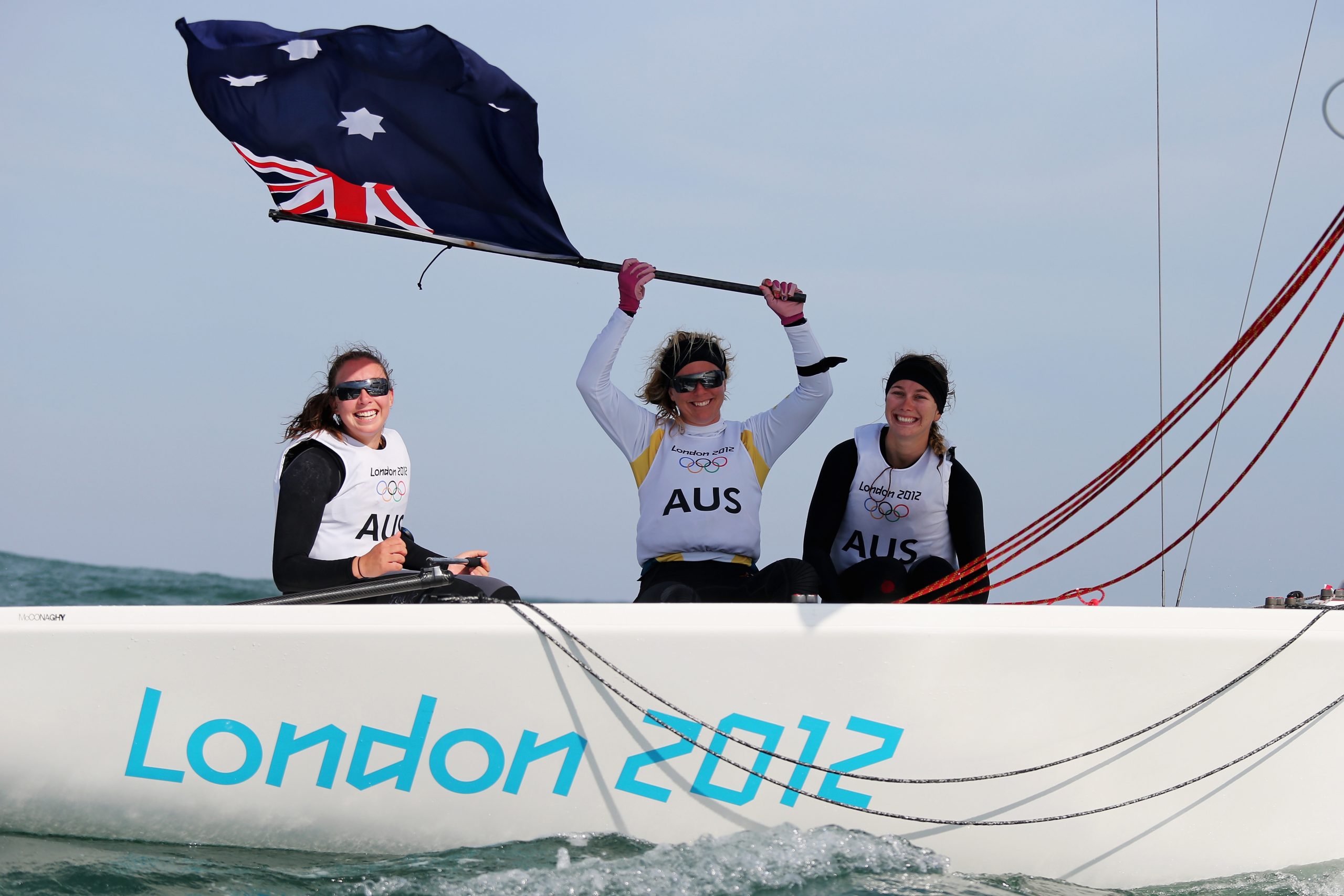 Olivia Price, Nina Curtis and Lucinda Whitty celebrate winning the silver medal in the Women's Elliott 6m WMR Sailing at the London 2012 Olympic Games.