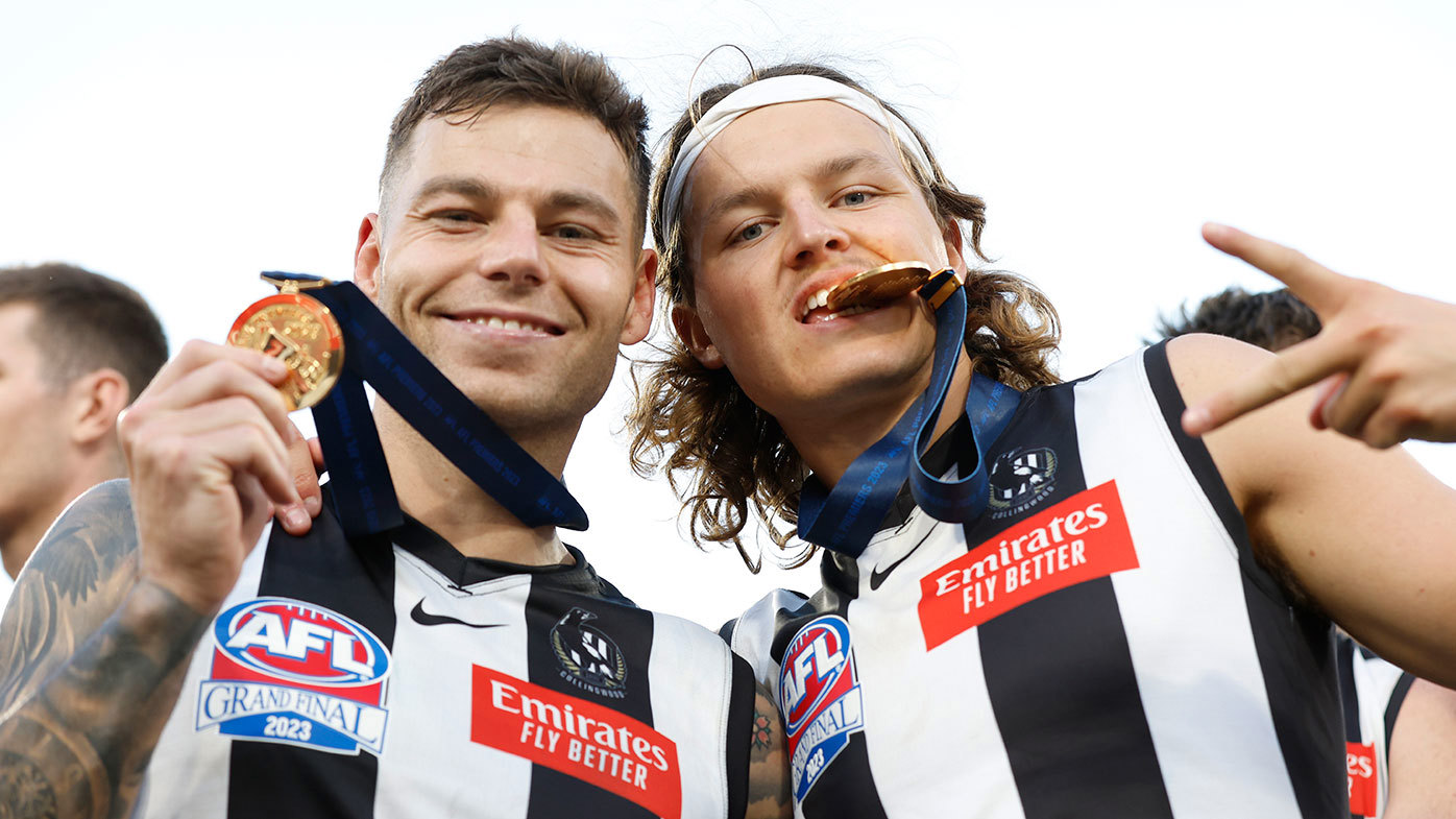 Collingwood stars Jamie Elliott and Jack Ginnivan pictured together after the 2023 AFL grand final