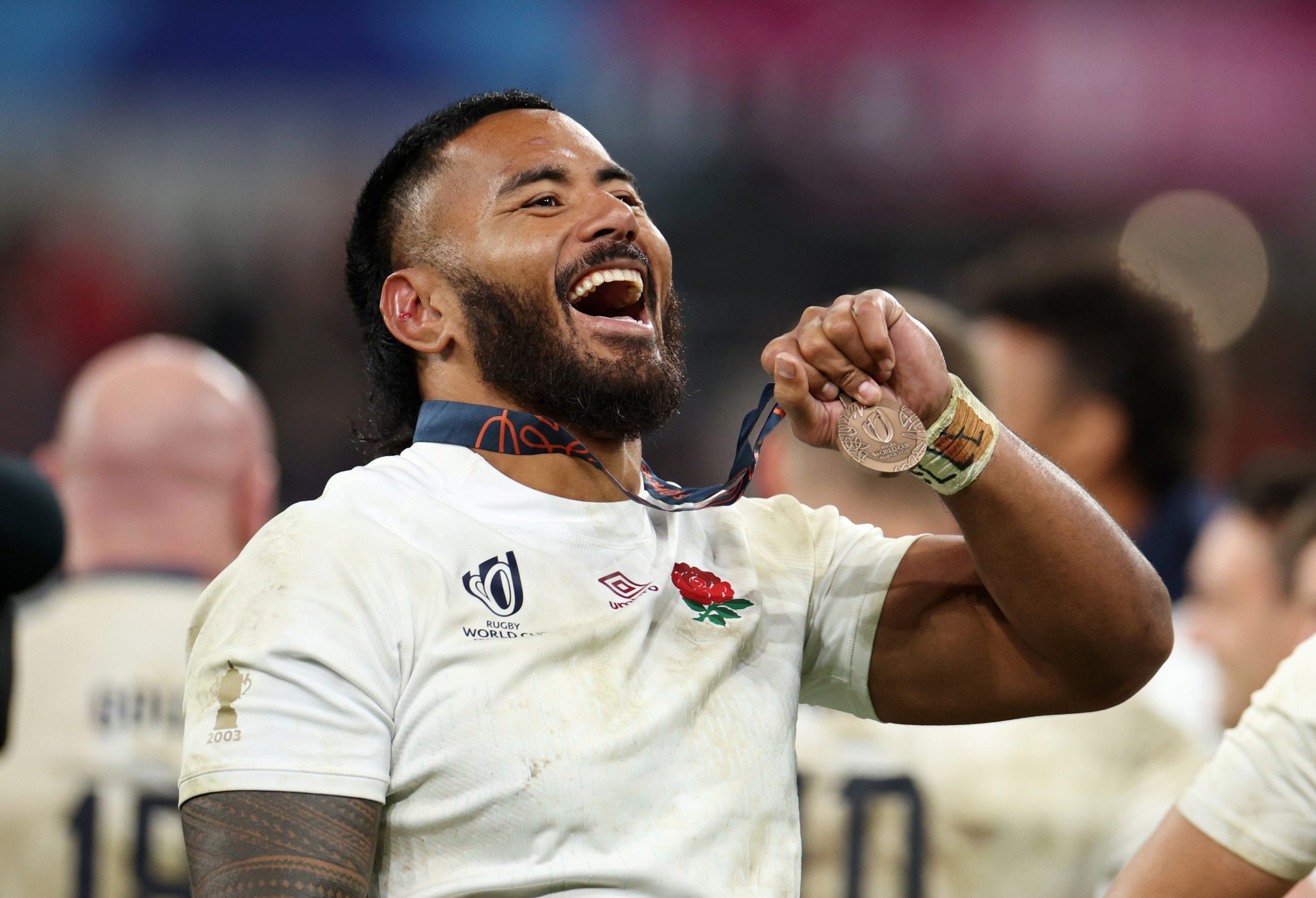 Manu Tuilagi of England shows appreciation to the fans after receiving his bronze medal.