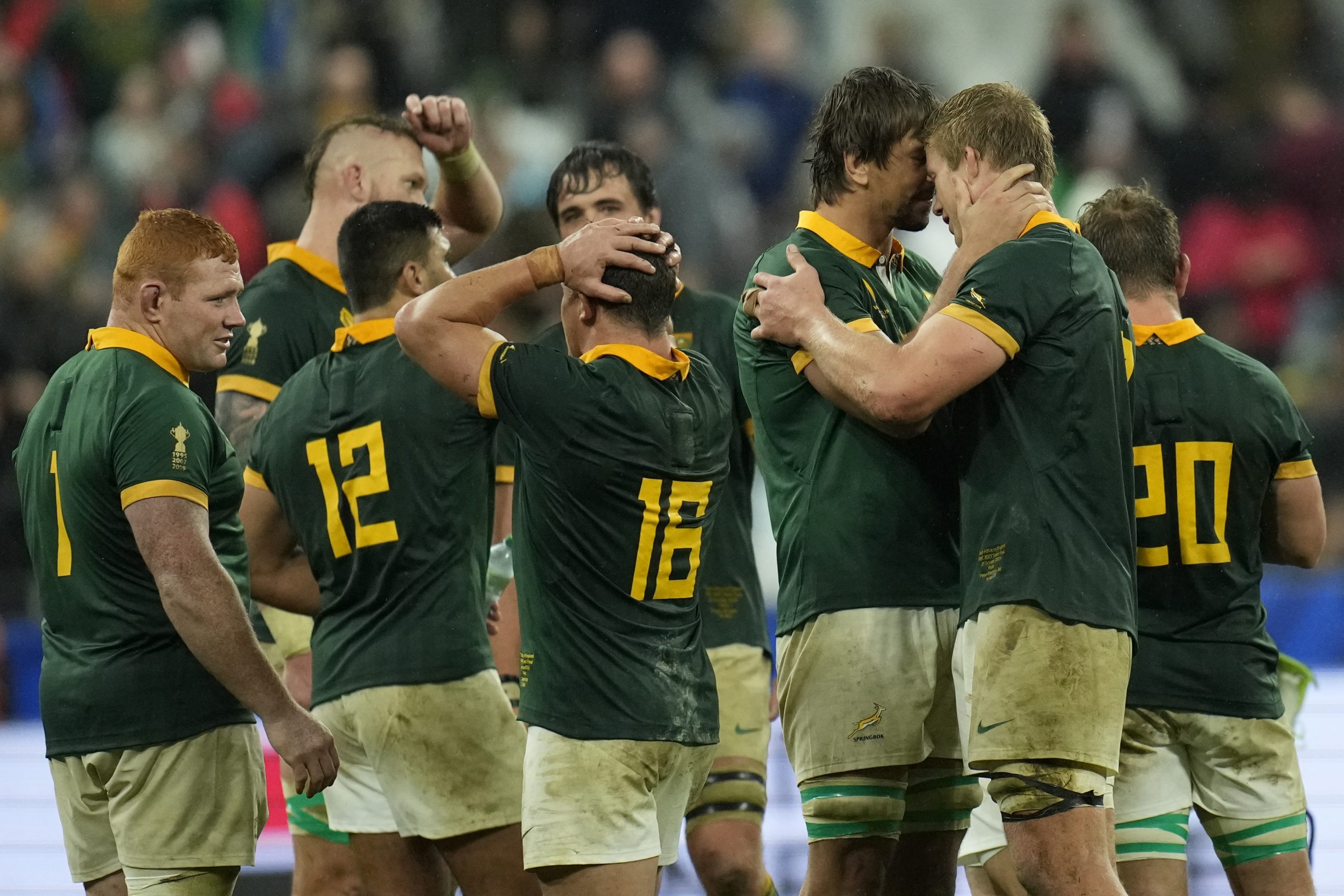 South Africa's Eben Etzebeth (second from right) celebrates with teammates after defeating England.