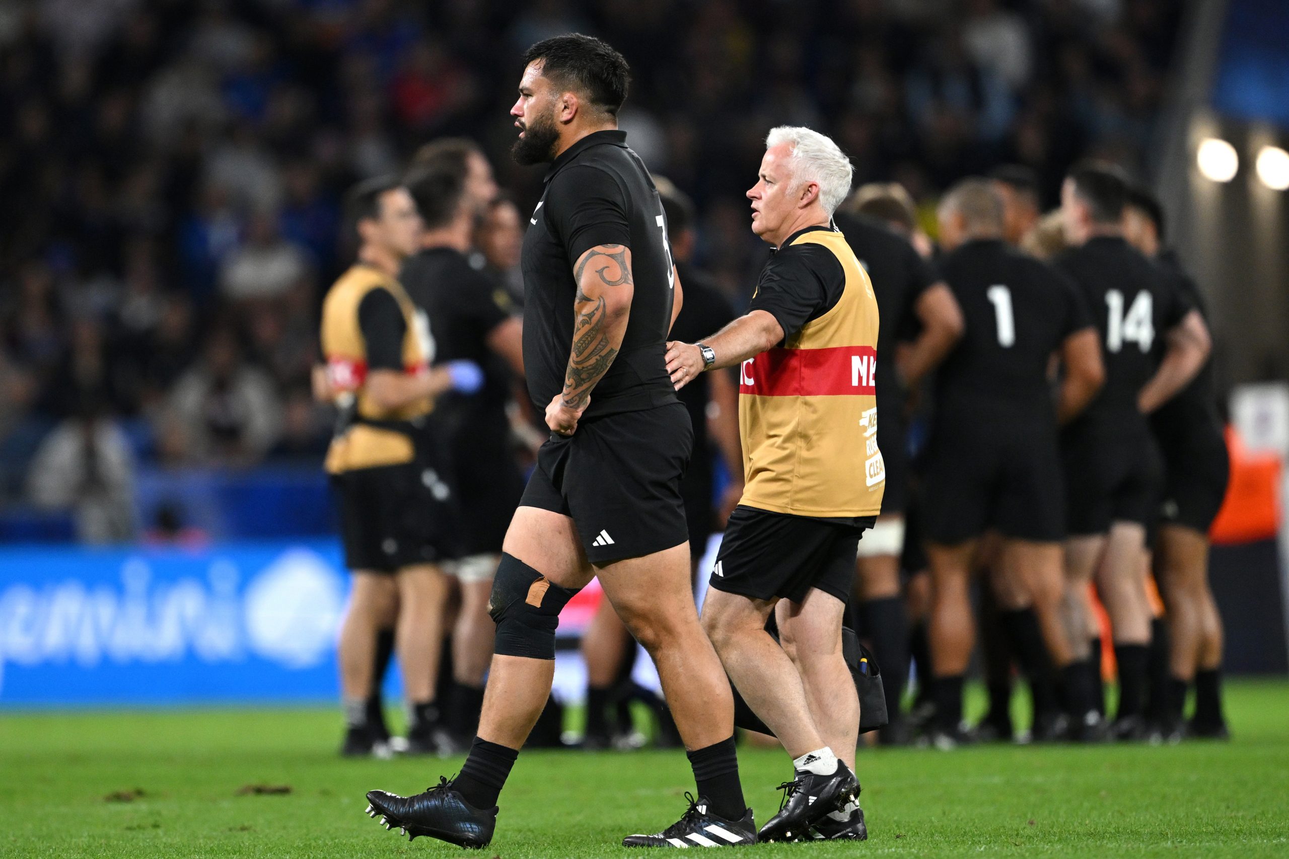 Tyrel Lomax of New Zealand  leaves the field dejected after receiving medical treatment.