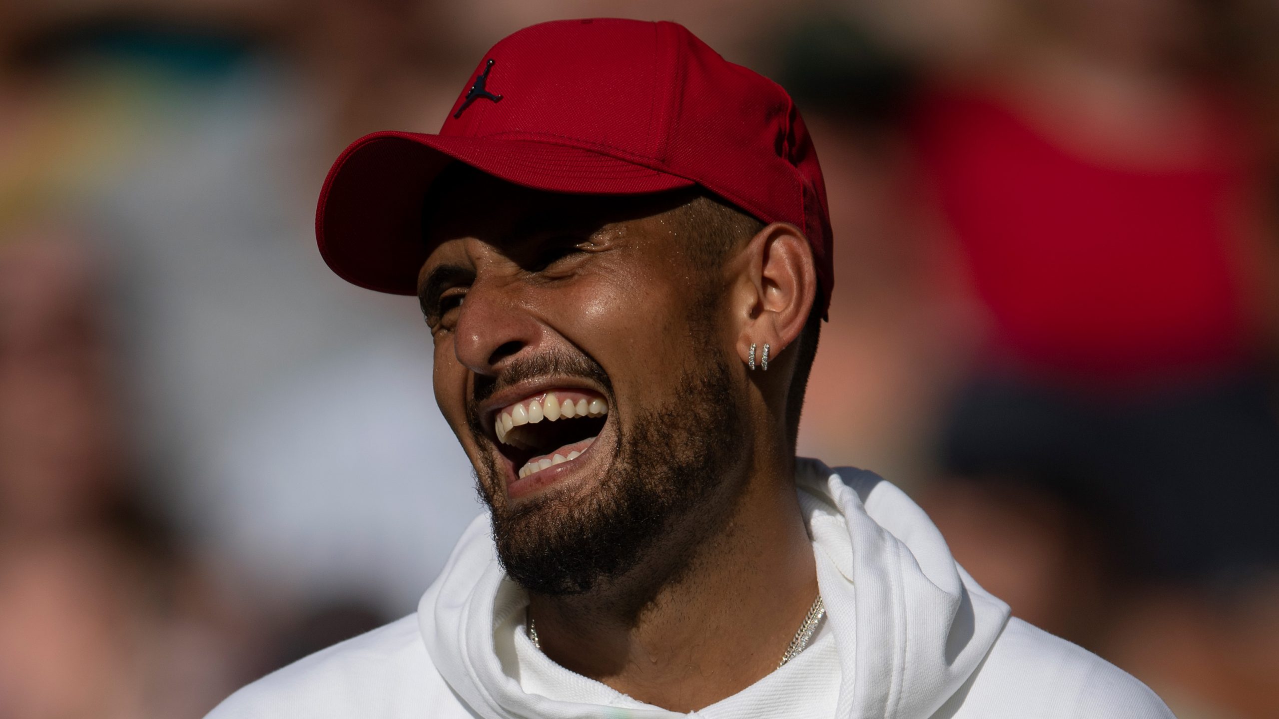 Nick Kyrgios of Australia smiling after losing to Novak Djokovic of Serbia during their Men's Singles Final match on day fourteen of The Championships Wimbledon 2022 at All England Lawn Tennis and Croquet Club on July 10, 2022 in London, England. (Photo by Visionhaus/Getty Images)