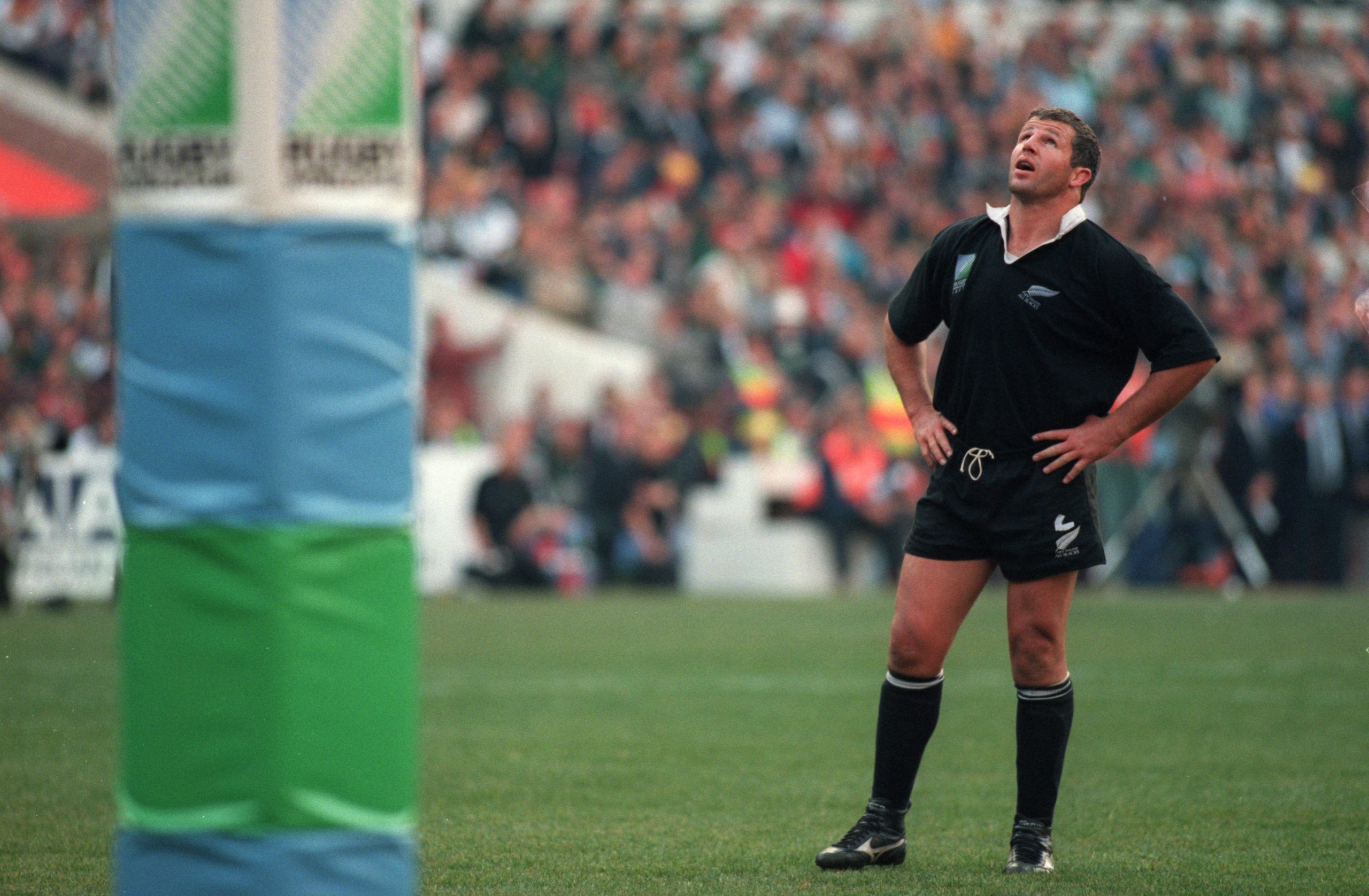 Sean Fitzpatrick of New Zealand watches as a penalty from Joel Stransky goes over the bar.