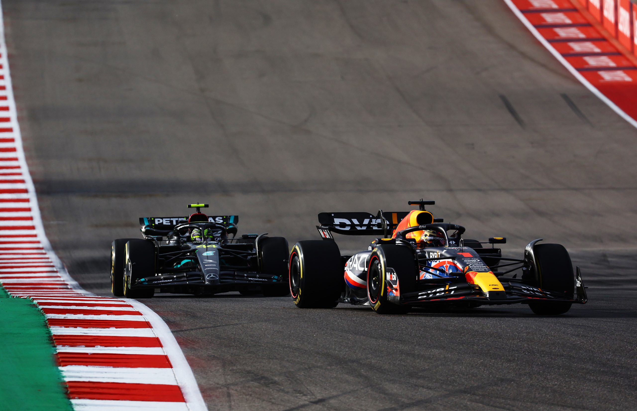 Max Verstappen of the Netherlands driving the (1) Oracle Red Bull Racing RB19 leads Lewis Hamilton of Great Britain driving the (44) Mercedes AMG Petronas F1 Team W14 during the Sprint ahead of the F1 Grand Prix of United States at Circuit of The Americas on October 21, 2023 in Austin, Texas. (Photo by Mark Thompson/Getty Images)
