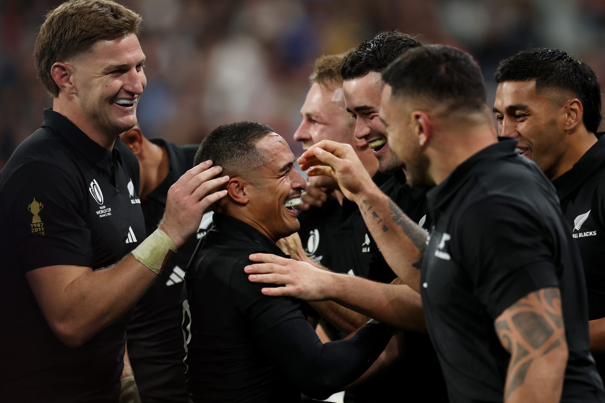 Aaron Smith (middle) of New Zealand celebrates with teammates after scoring his team's fourth try against Argentina.