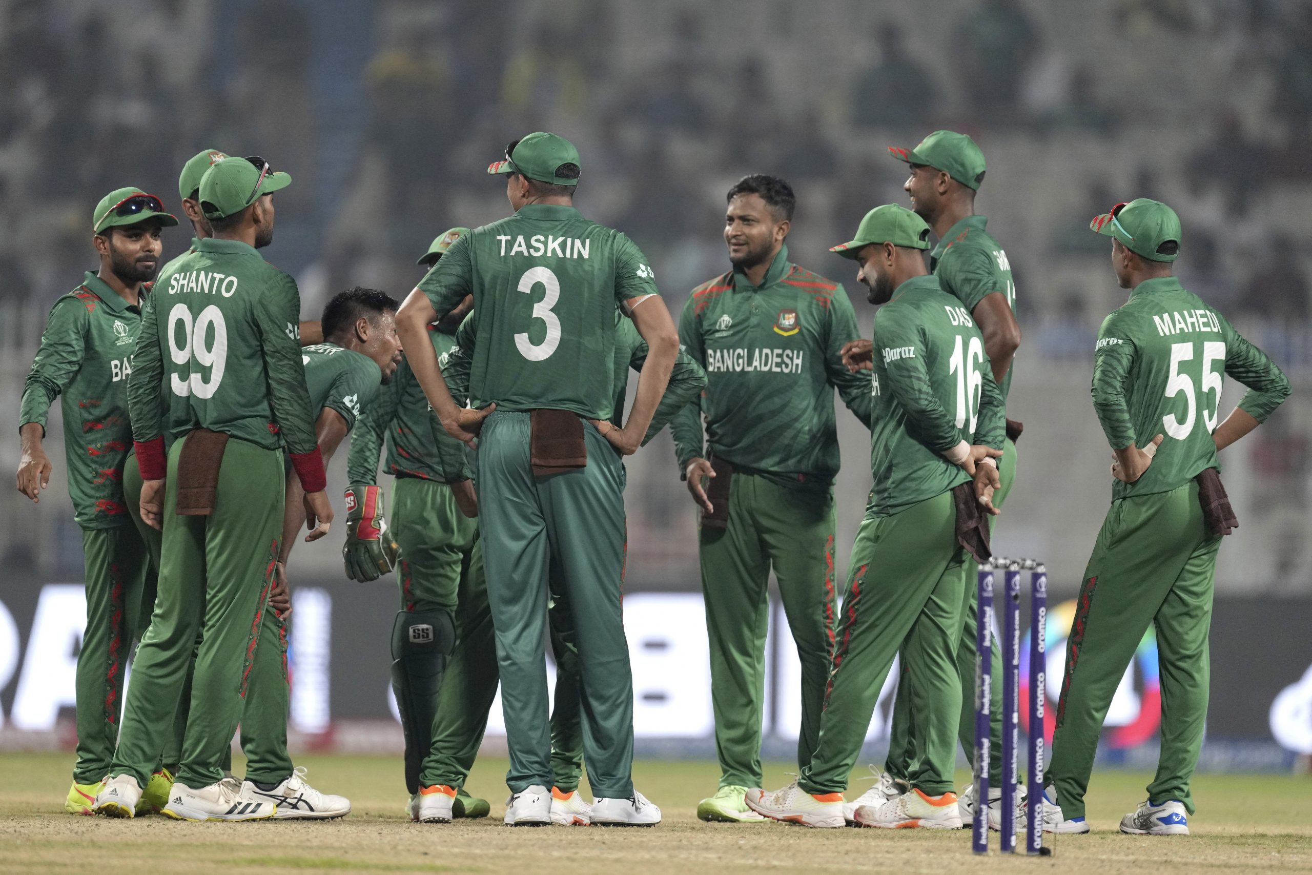 Bangladesh's captain Shakib Al Hasan, fourth right, and teammates await third umpire's decision for the wicket of Netherlands' Sybrand Engelbrecht during the ICC Men's Cricket World Cup match between Bangladesh and Netherlands in Kolkata, India, Saturday, Oct. 28, 2023. (AP Photo/Bikas Das)