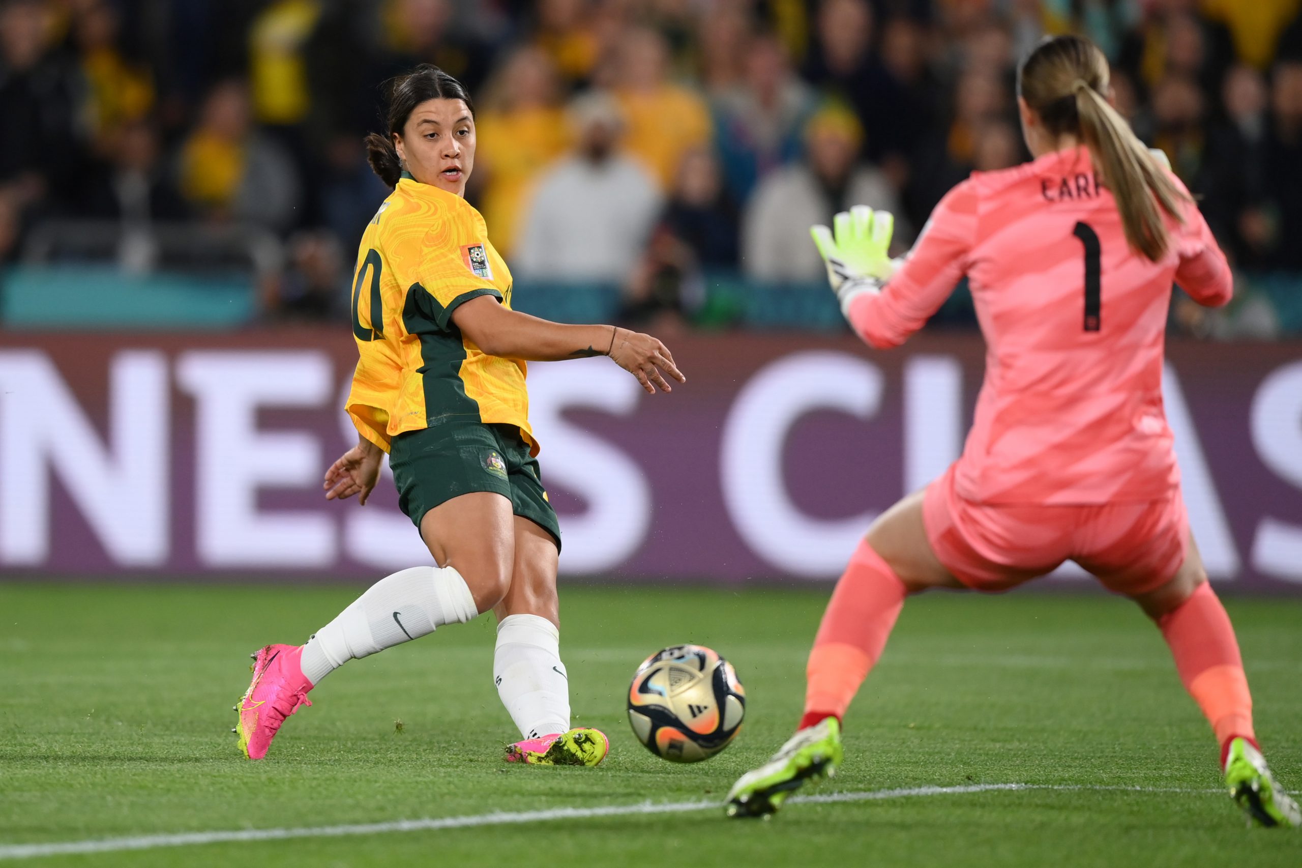 Sam Kerr of Australia shoots while Mary Earps of England makes a save.