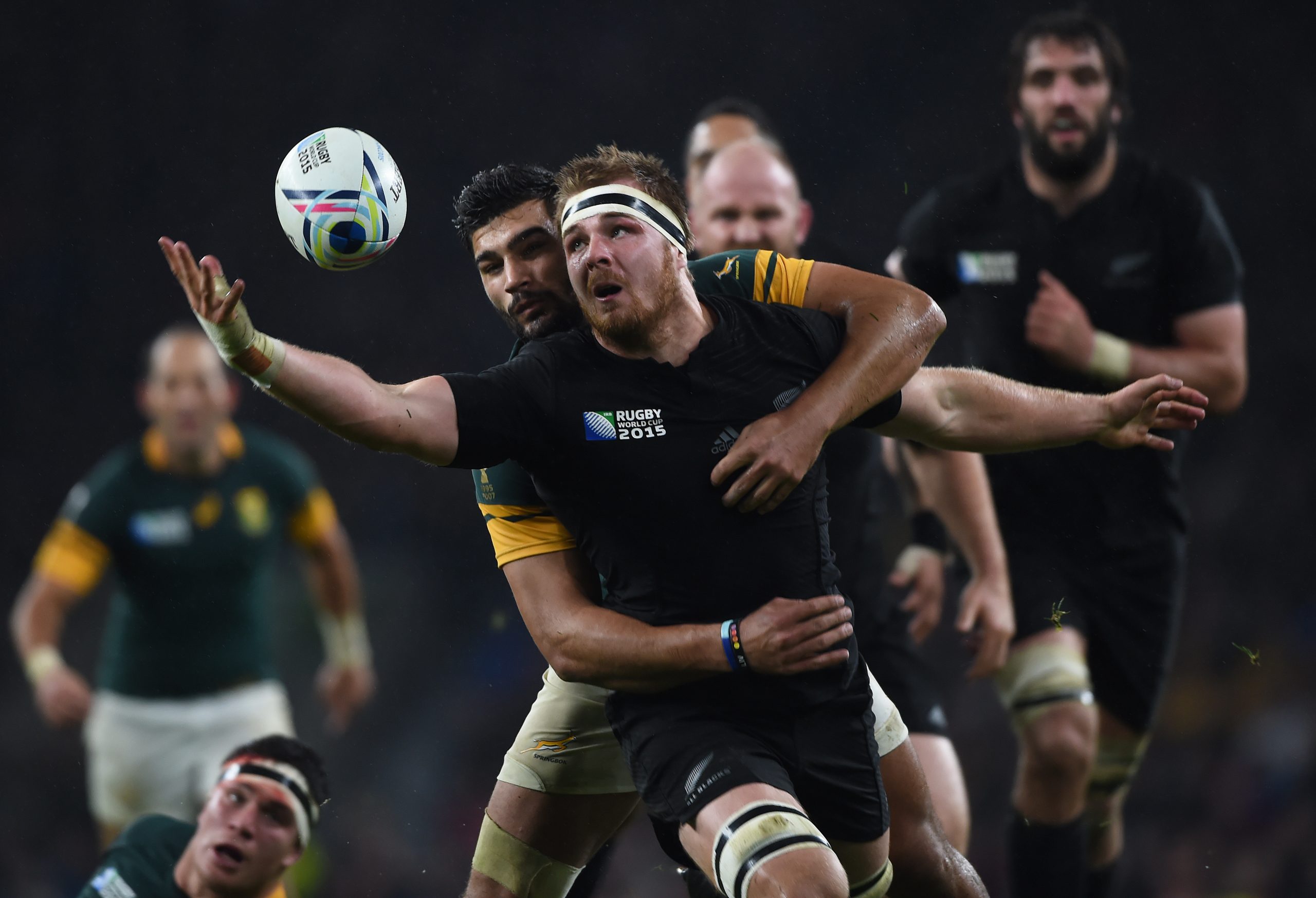 Sam Cane of New Zealand and Damian de Allende of South Africa in action.