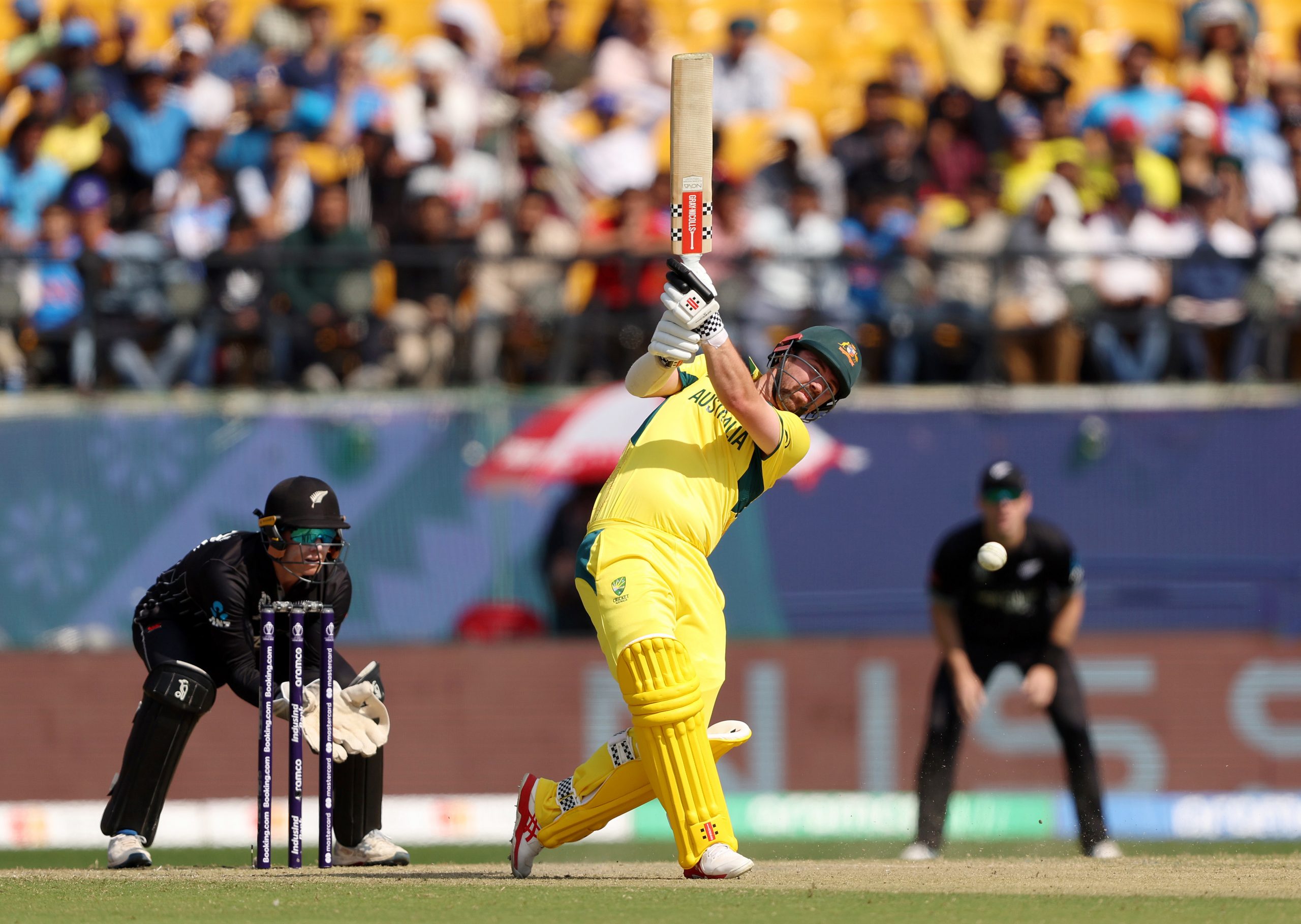 Travis Head dances down the wicket.