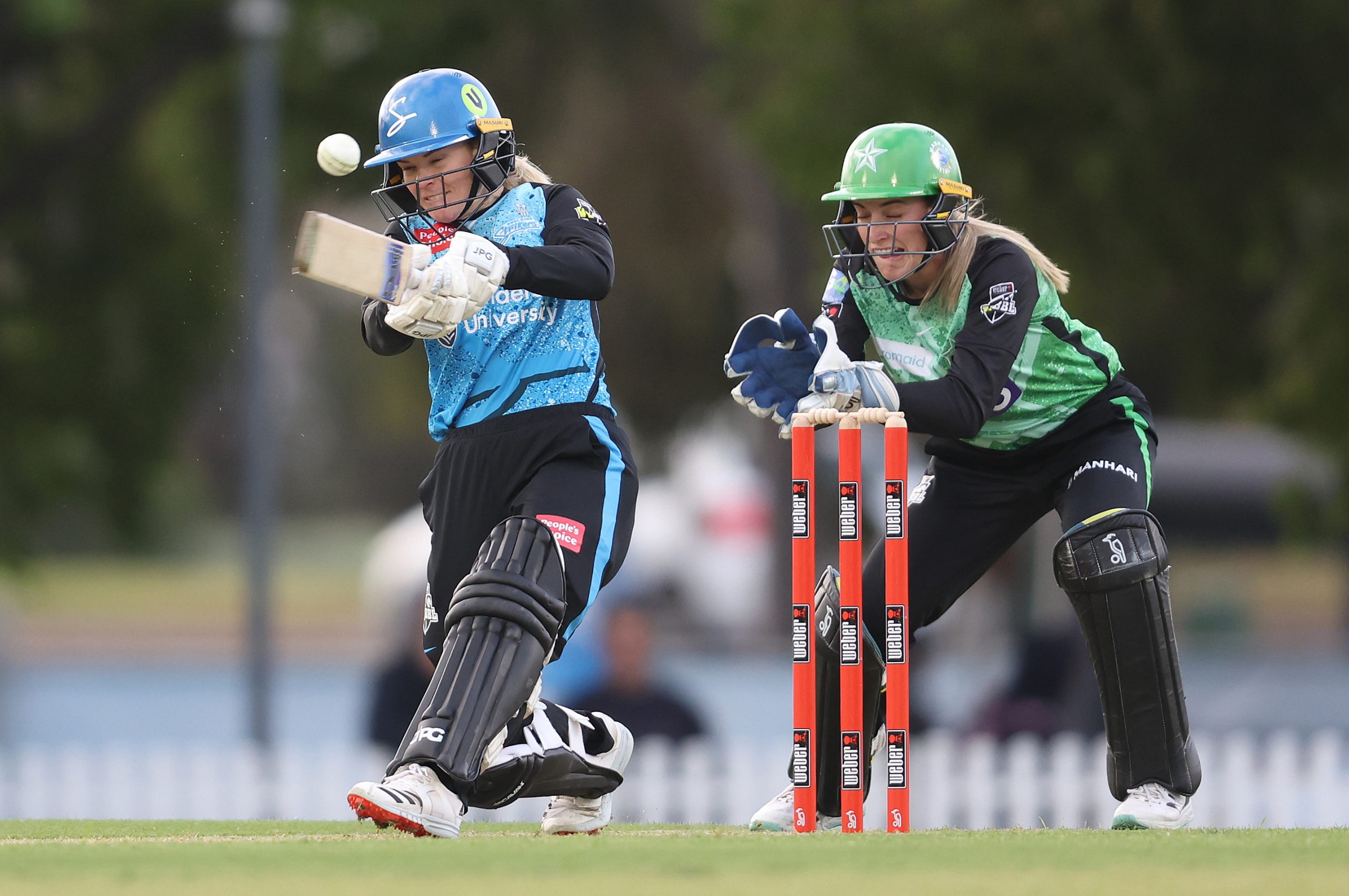 Katie Mack of the Adelaide Strikers  and Nicole Faltum of the Melbourne Starsduring the WBBL match between Adelaide Strikers and Melbourne Stars at Karen Rolton Oval, on October 21, 2023, in Adelaide, Australia. (Photo by Sarah Reed/Getty Images)