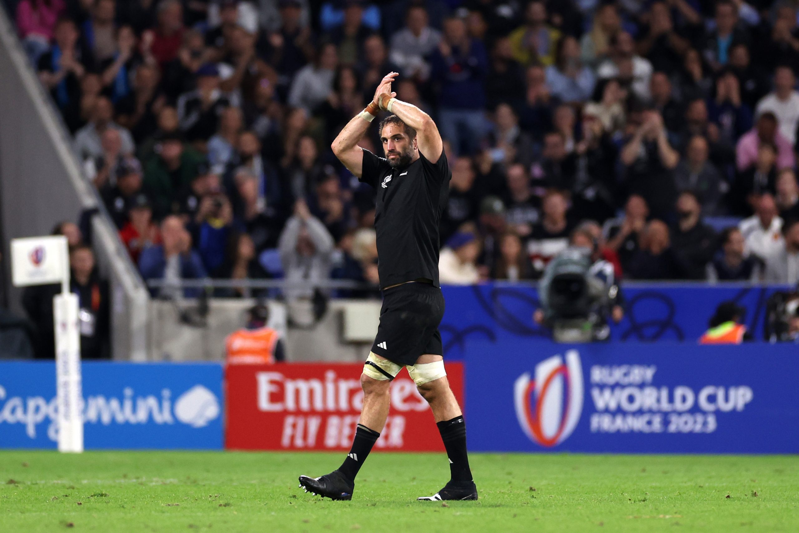 Sam Whitelock of New Zealand applauds the fans as he leaves the field.