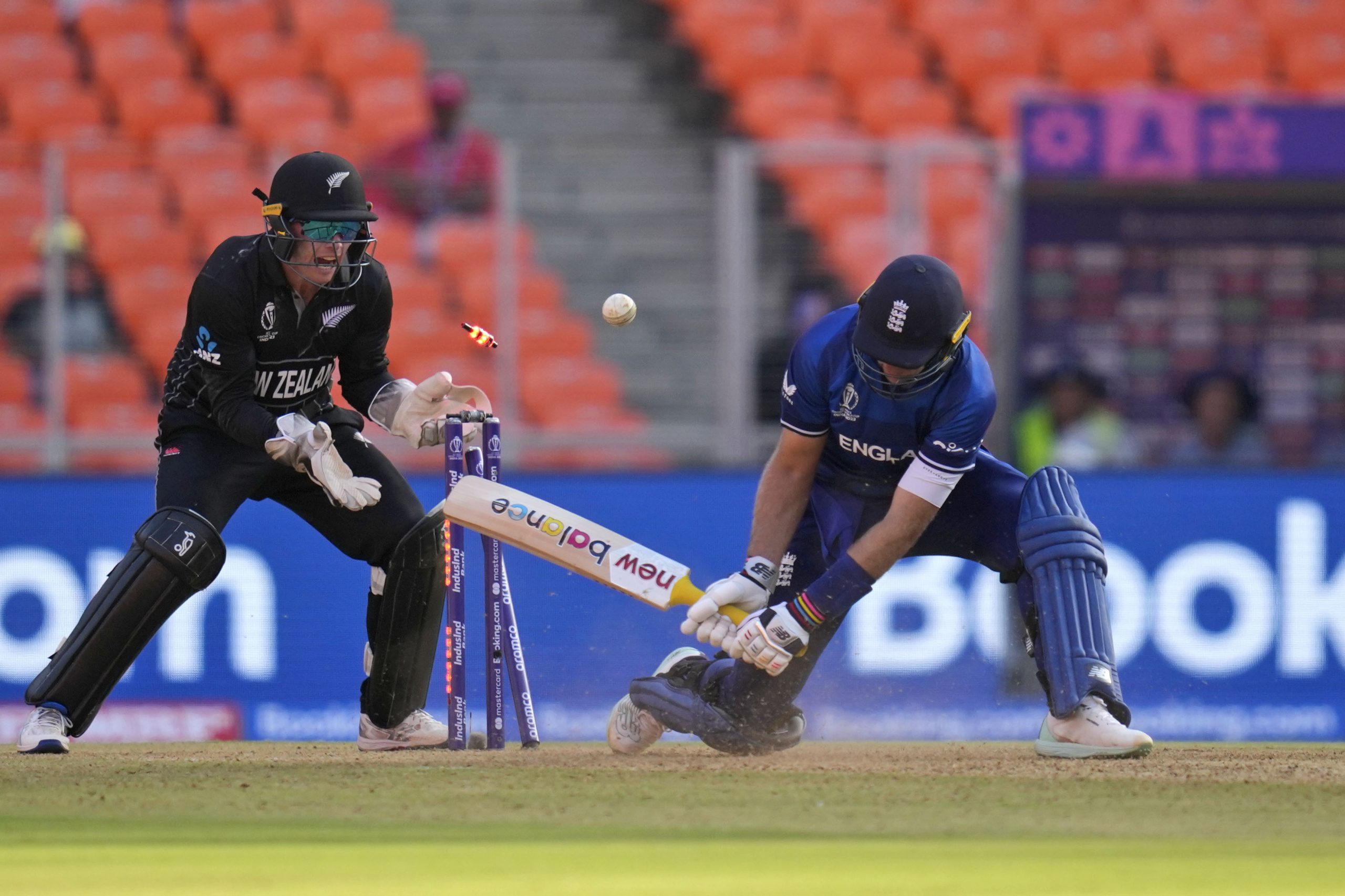 England's Joe Root is bowled out during the ICC Cricket World Cup opening match between England and New Zealand in Ahmedabad, India, Thursday, Oct. 5, 2023. (AP Photo/Rafiq Maqbool)