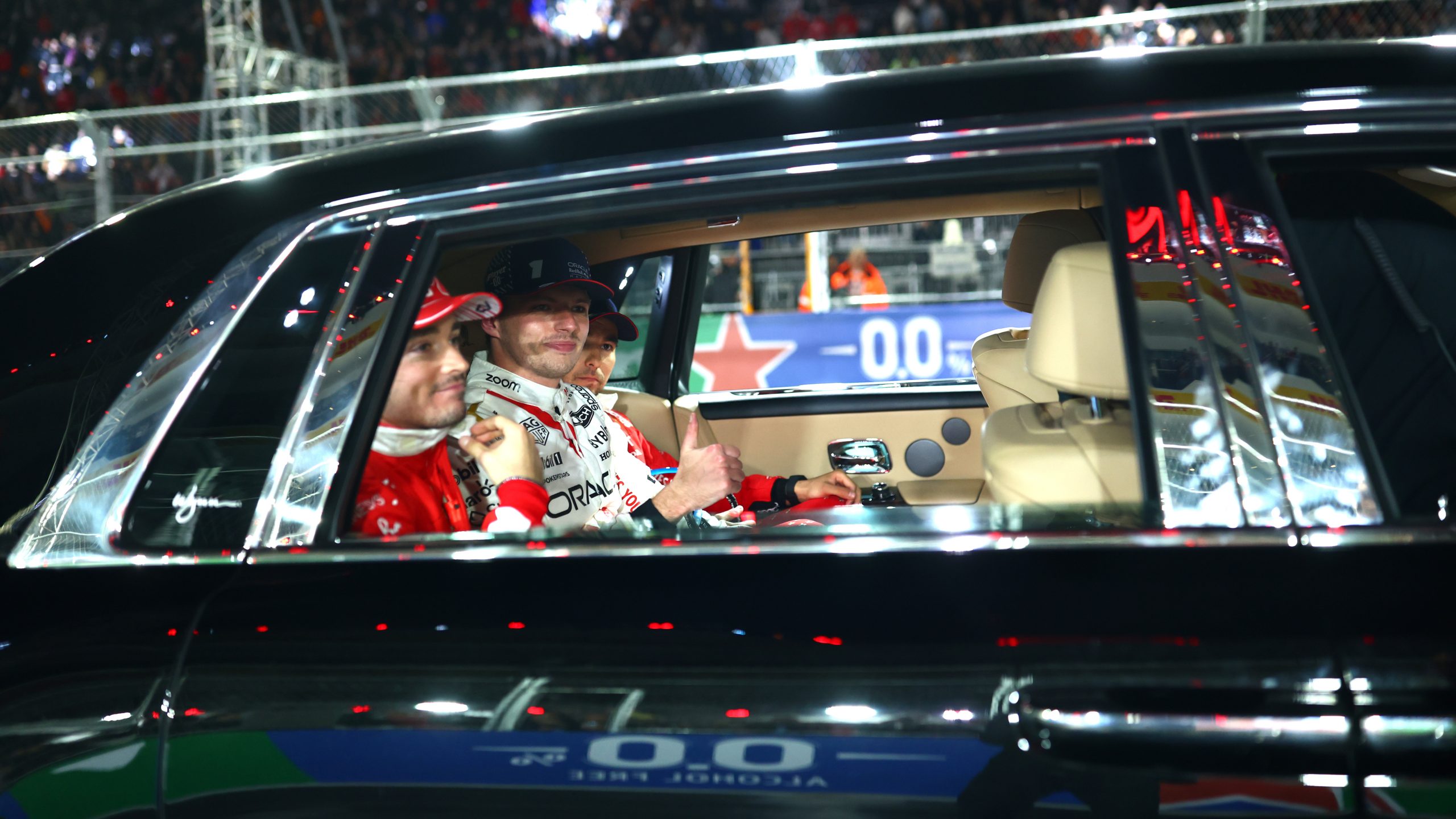 Max Verstappen, Charles Leclerc and Sergio Perez make their way to podium at the Las Vegas Grand Prix.