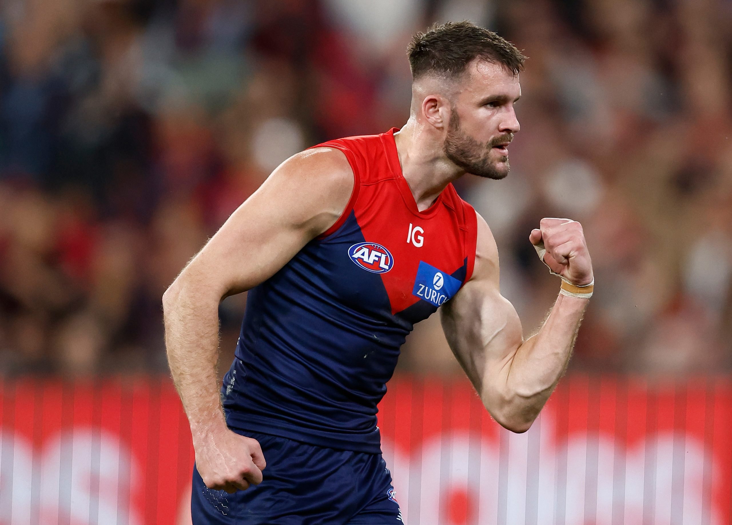 Joel Smith of the Demons celebrates a goal during the 2023 AFL first semi-final match between the Melbourne Demons and the Carlton Blues.
