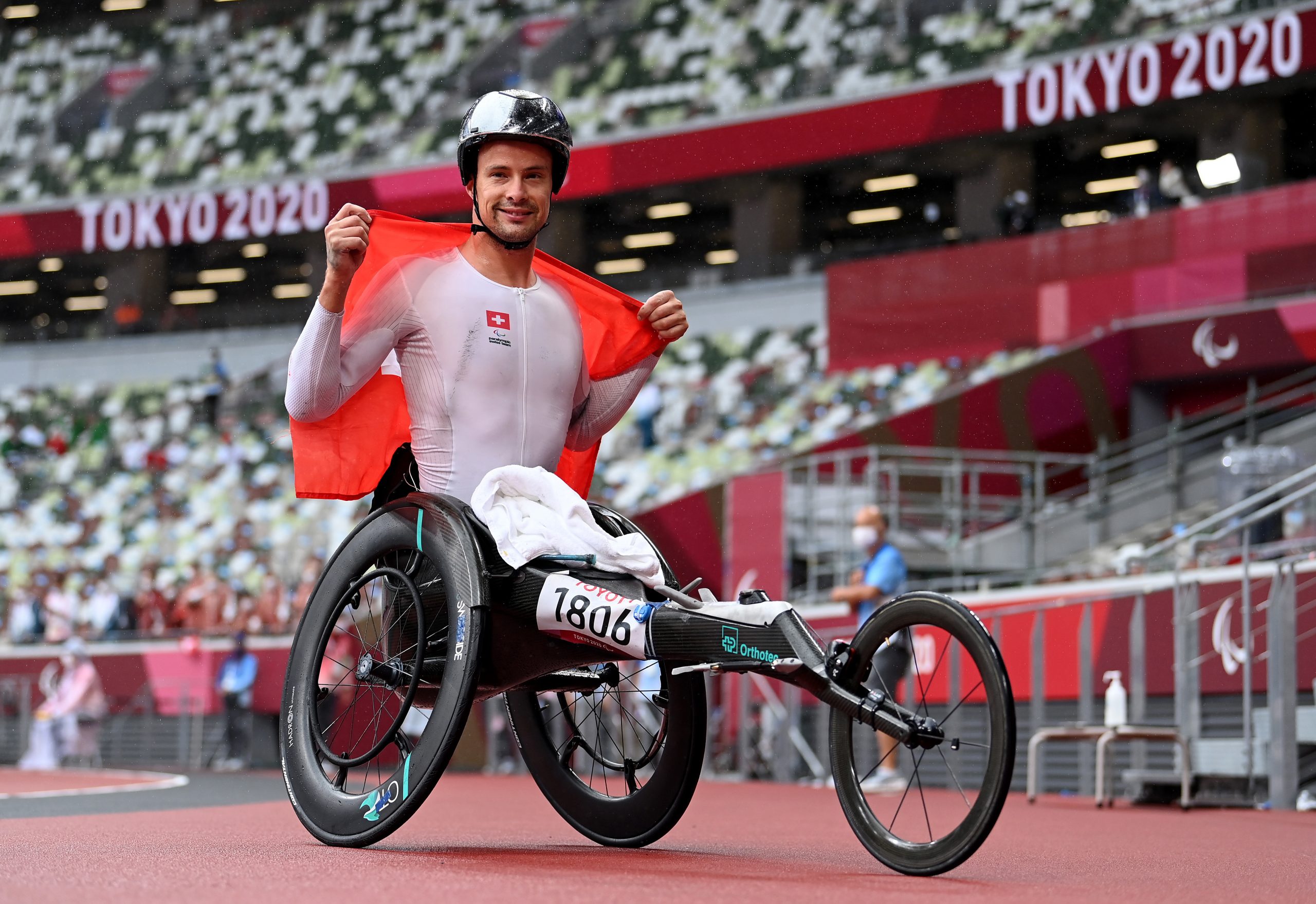 Switzerland's Marcel Hug, pictured in his Sauber OT FOXX, celebrates winning the men's marathon at the 2020 Tokyo Paralympics.