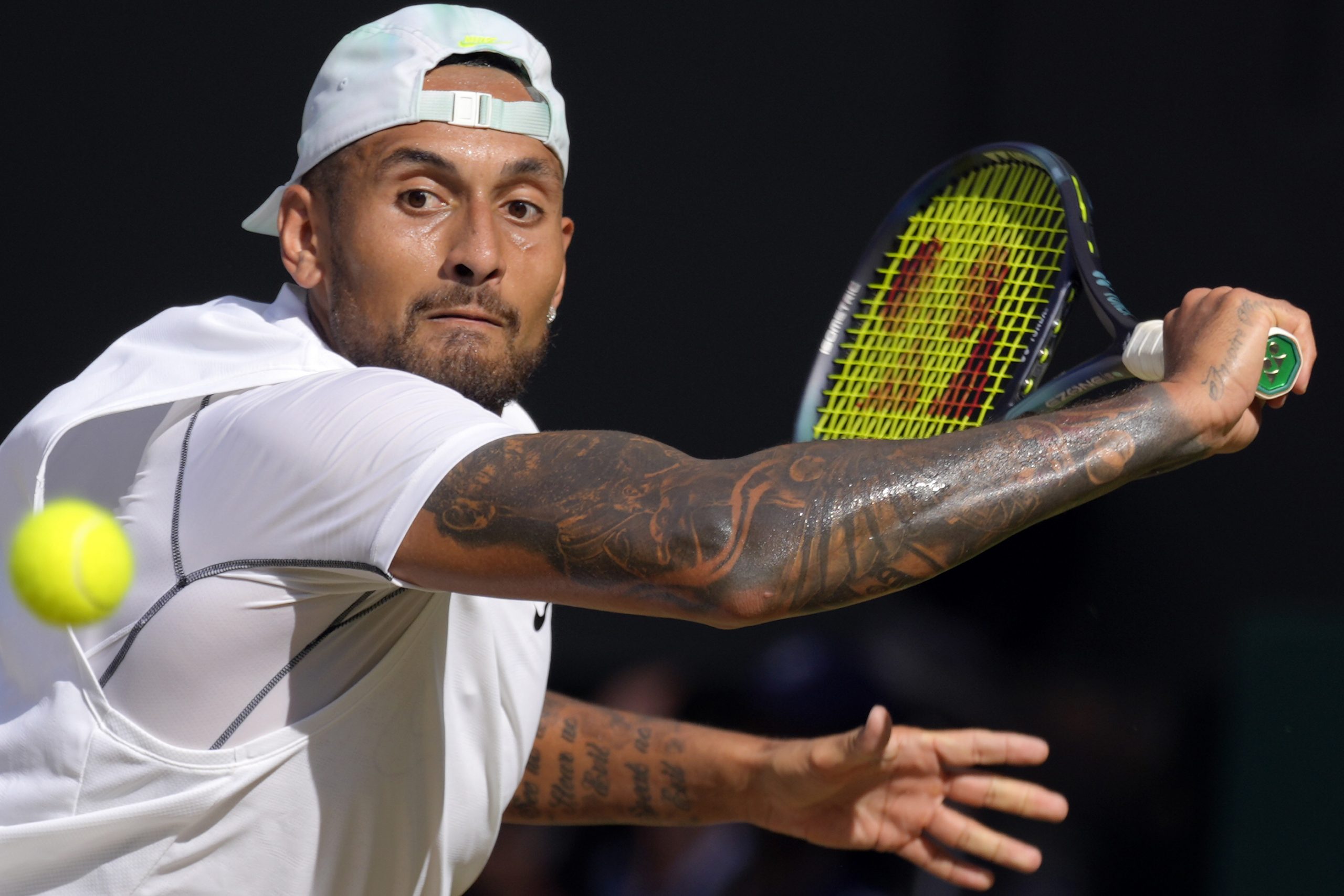 Australia's Nick Kyrgios returns to Serbia's Novak Djokovic during the Wimbledon men's final.
