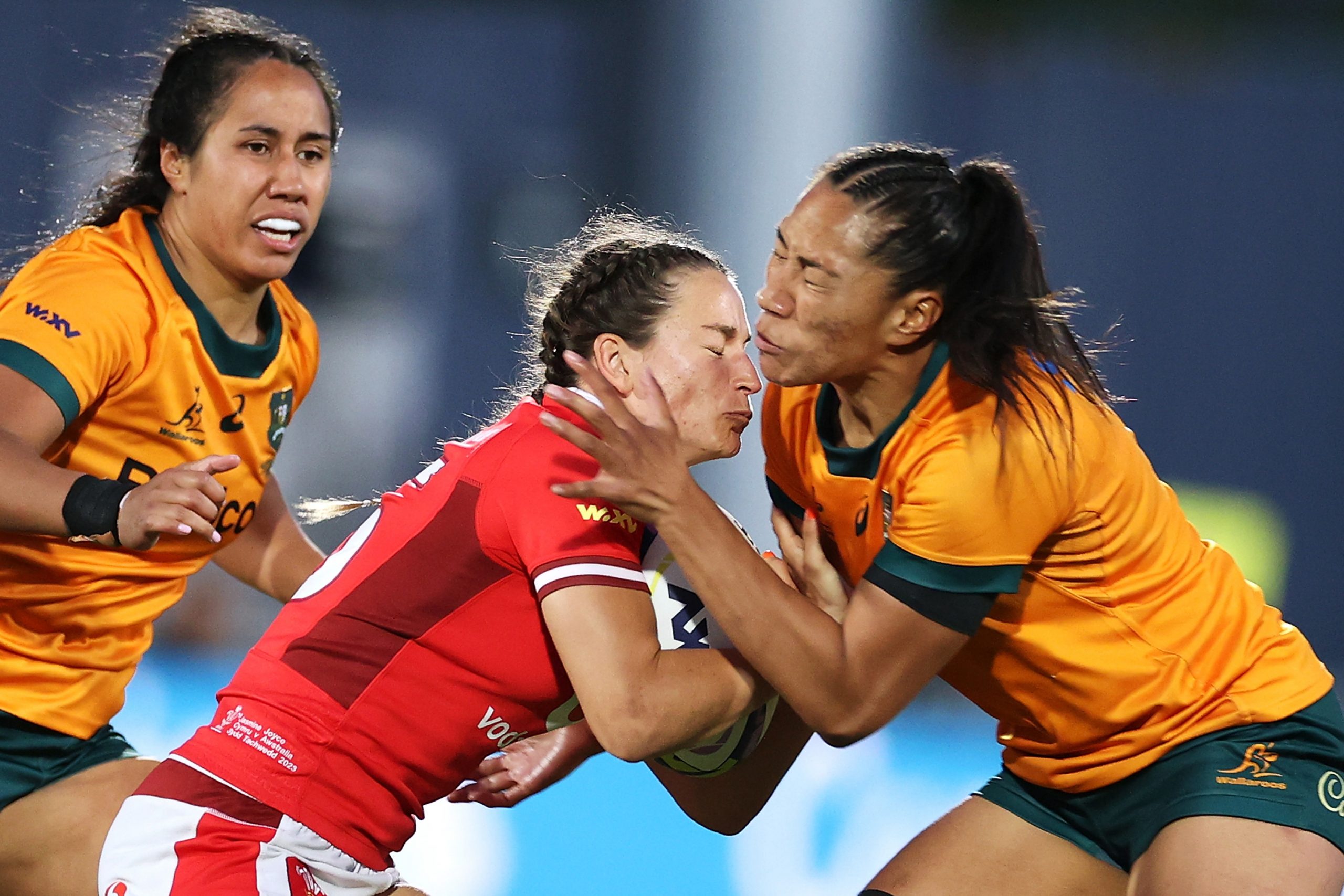 Jasmine Joyce of Wales is tackled by Siokapesi Palu of Australia.