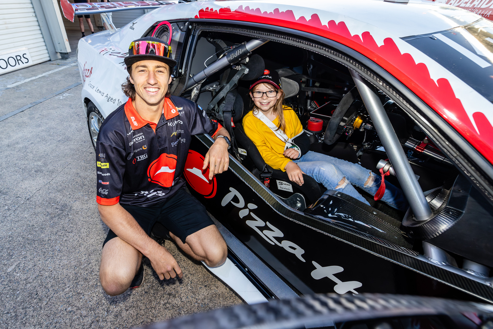 Grace Lewis and Macauley Jones in the pit lane ahead of the Adelaide 500.