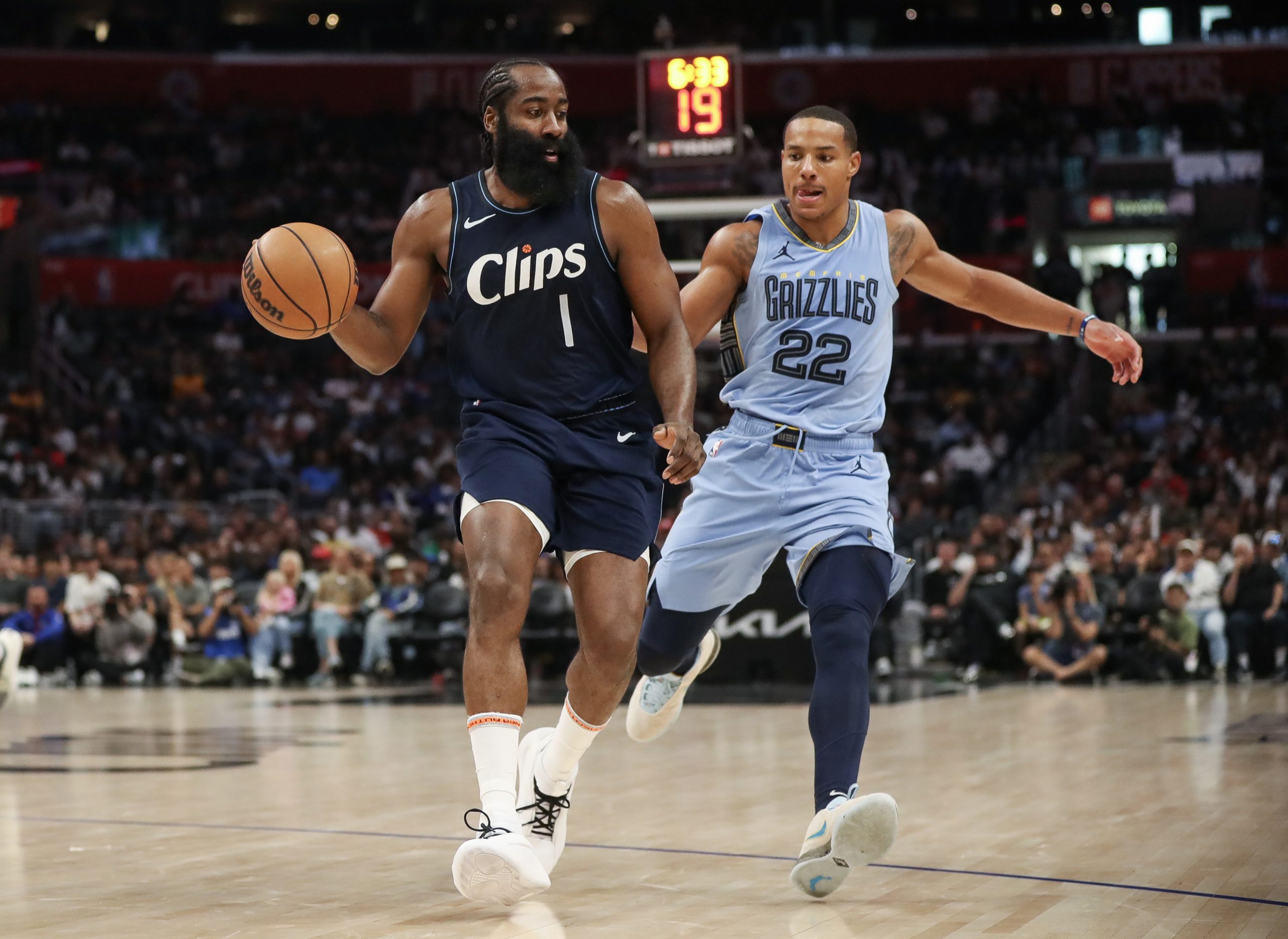 LOS ANGELES, CALIFORNIA - NOVEMBER 12: James Harden #1 of the LA Clippers handles the ball ahead of Desmond Bane #22 of the Memphis Grizzlies in the second half at Crypto.com Arena on November 12, 2023 in Los Angeles, California. 