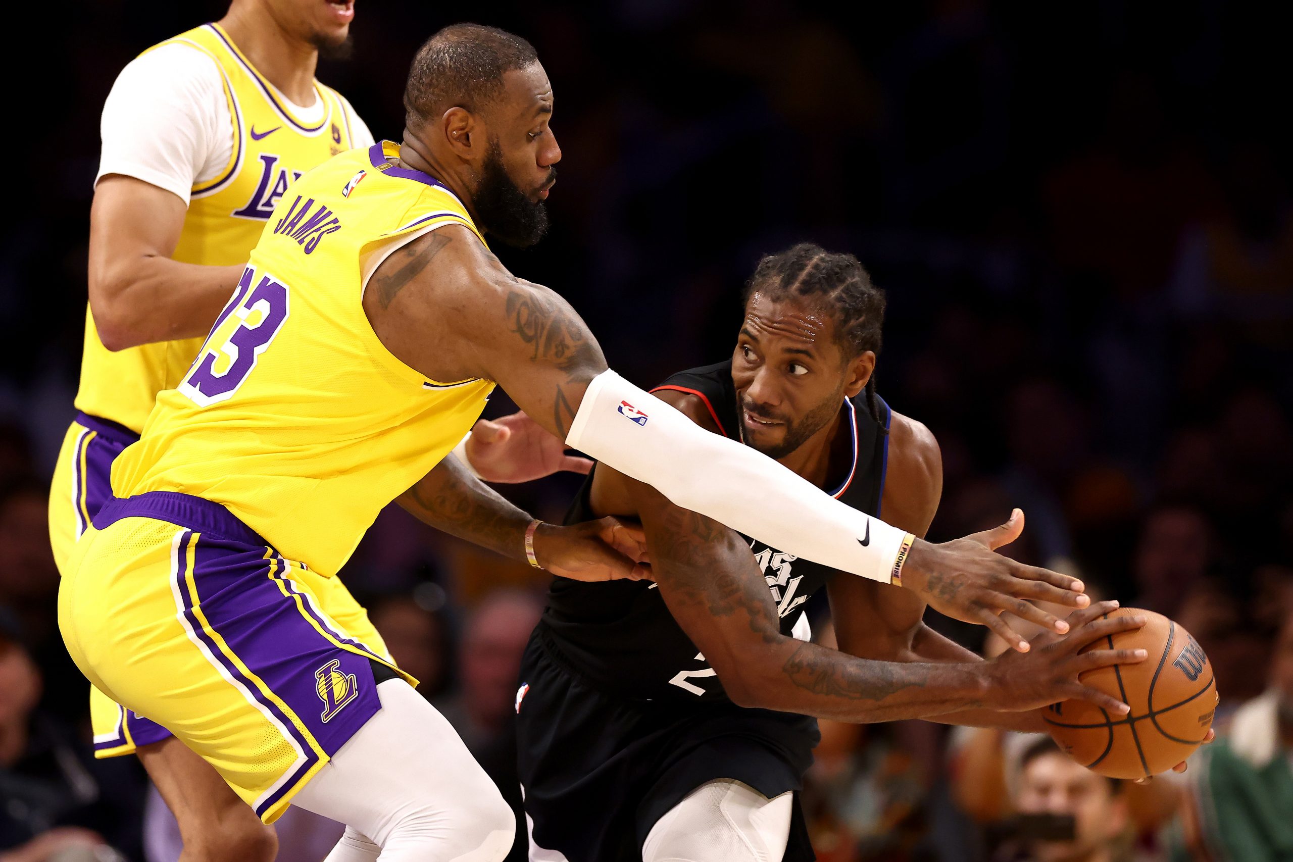 LOS ANGELES, CALIFORNIA - NOVEMBER 01: Kawhi Leonard #2 of the Los Angeles Clippers handles the ball against LeBron James #23 of the Los Angeles Lakers during the second quarter at Crypto.com Arena on November 01, 2023 in Los Angeles, California. 