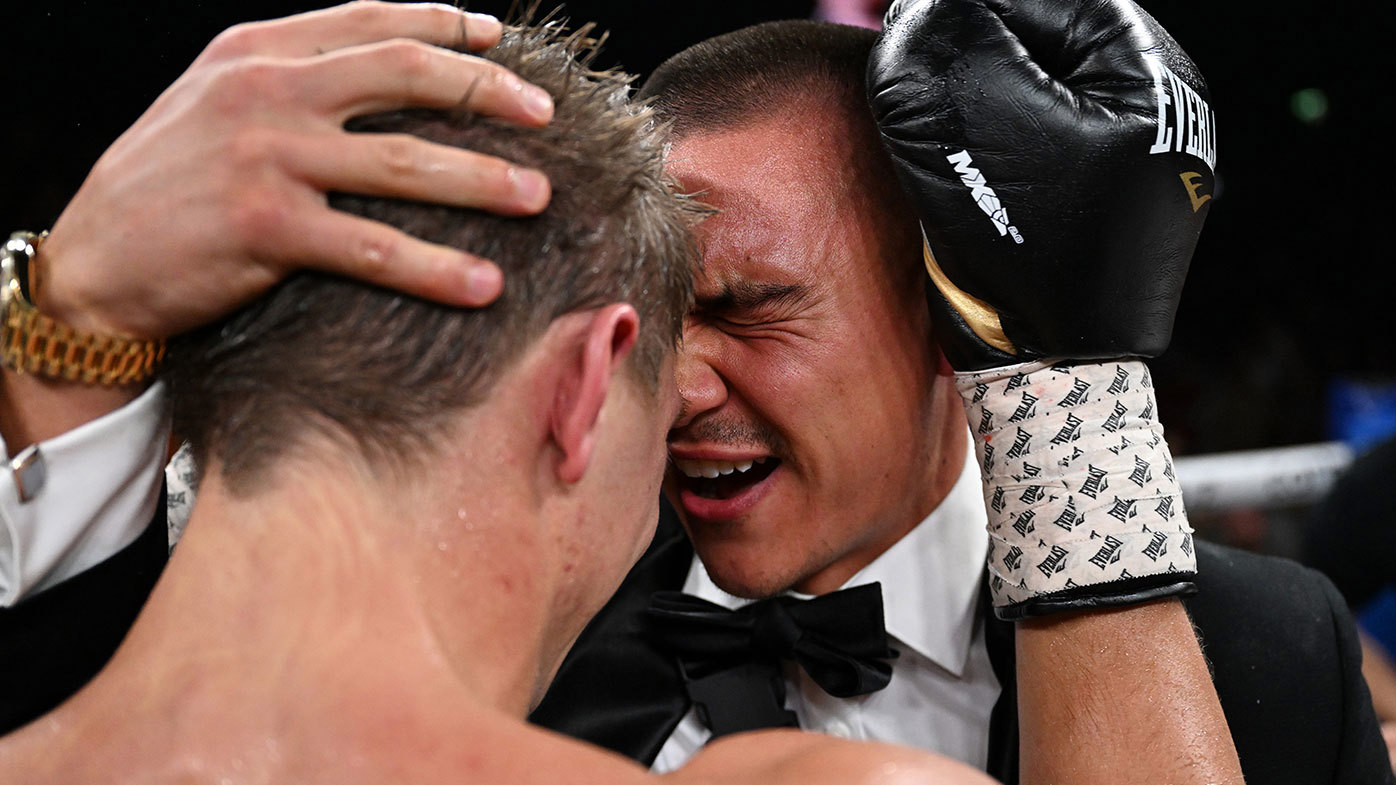 Nikita Tszyu celebrates with his older brother Tim Tszyu after winning the title