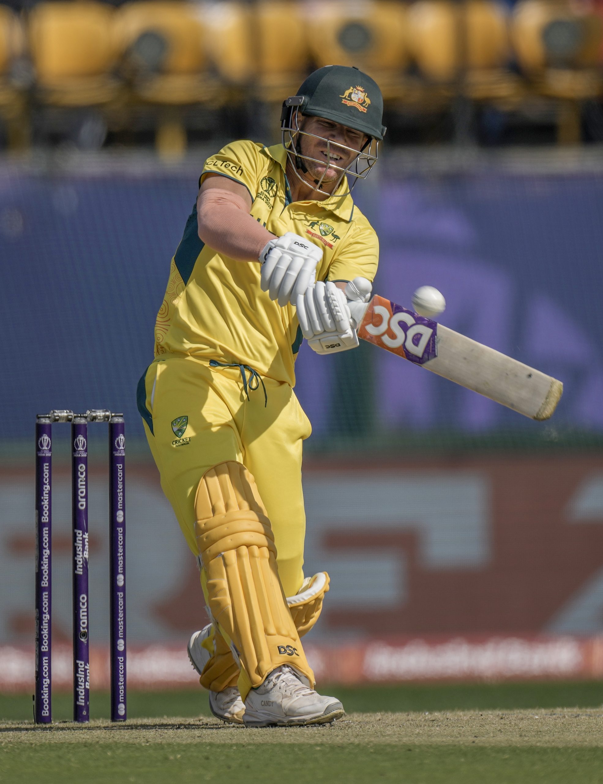 Australia's David Warner plays a shot during the ICC Men's Cricket World Cup match between Australia and New Zealand in Dharamshala, India,Saturday, Oct. 28, 2023. (AP Photo/Ashwini Bhatia)