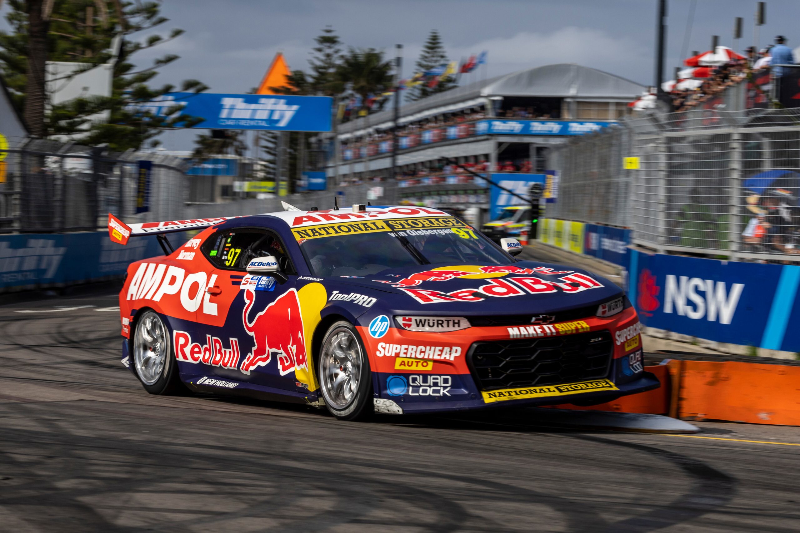 Shane van Gisbergen climbs a kerb at turn one.