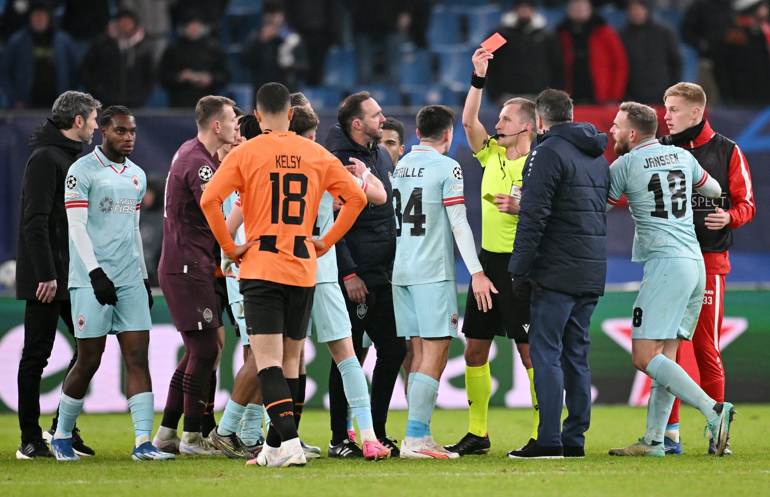Referee Bartosz Frankowski shows a red card to Arbnor Muja of Antwerp.