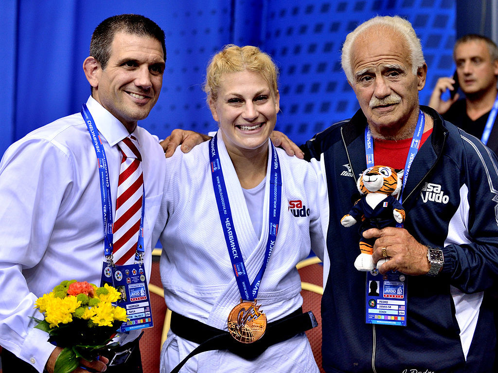 Kayla Harrison with her coaches Jimmy Pedro Jr and Jimmy Pedro Sr in Chelyabinsk.