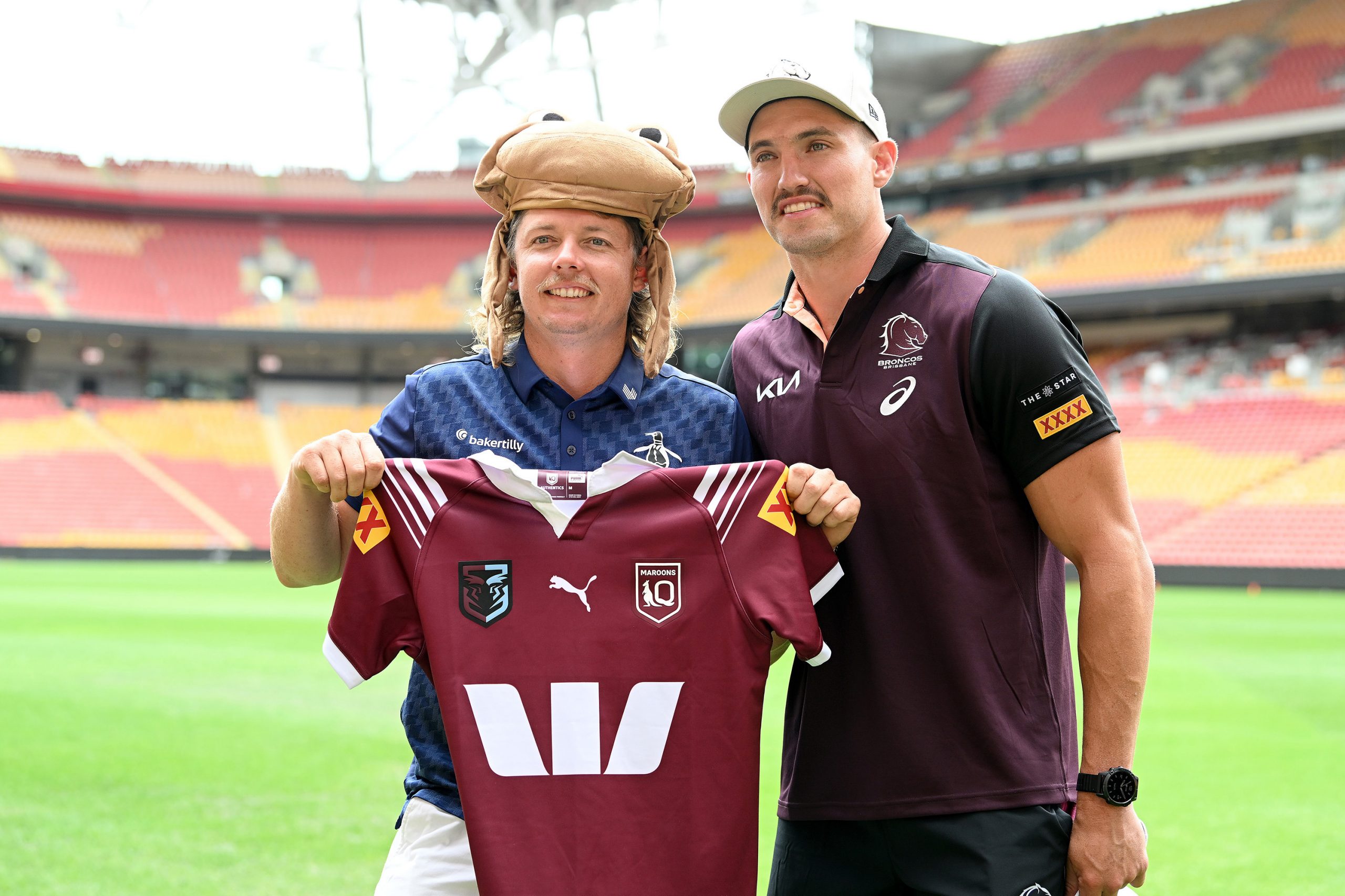 Cameron Smith poses with Broncos star Corey Oates at Suncorp Stadium.