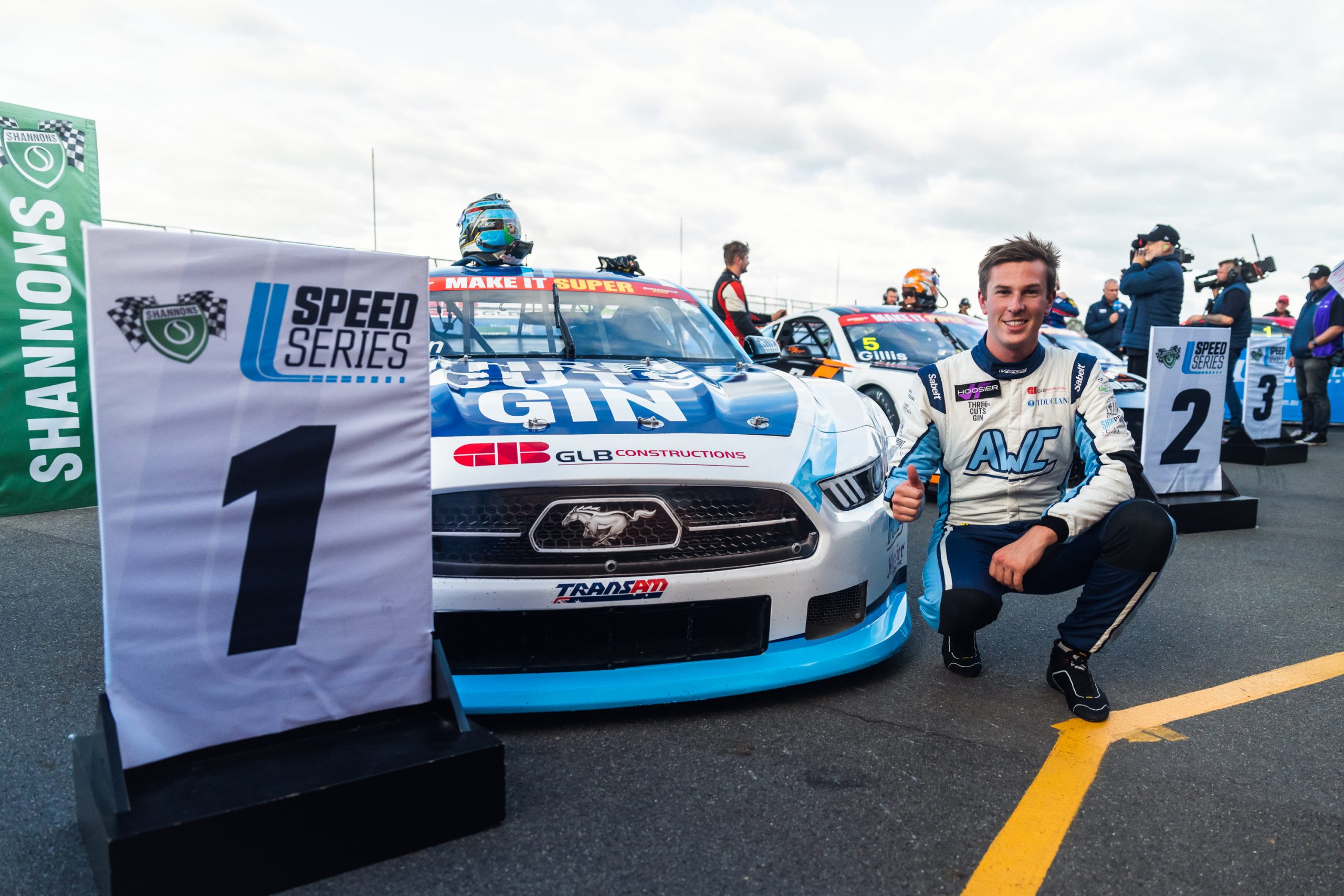 Lochie Dalton poses after winning a race in the National Trans Am Series at Winton Motor Raceway.