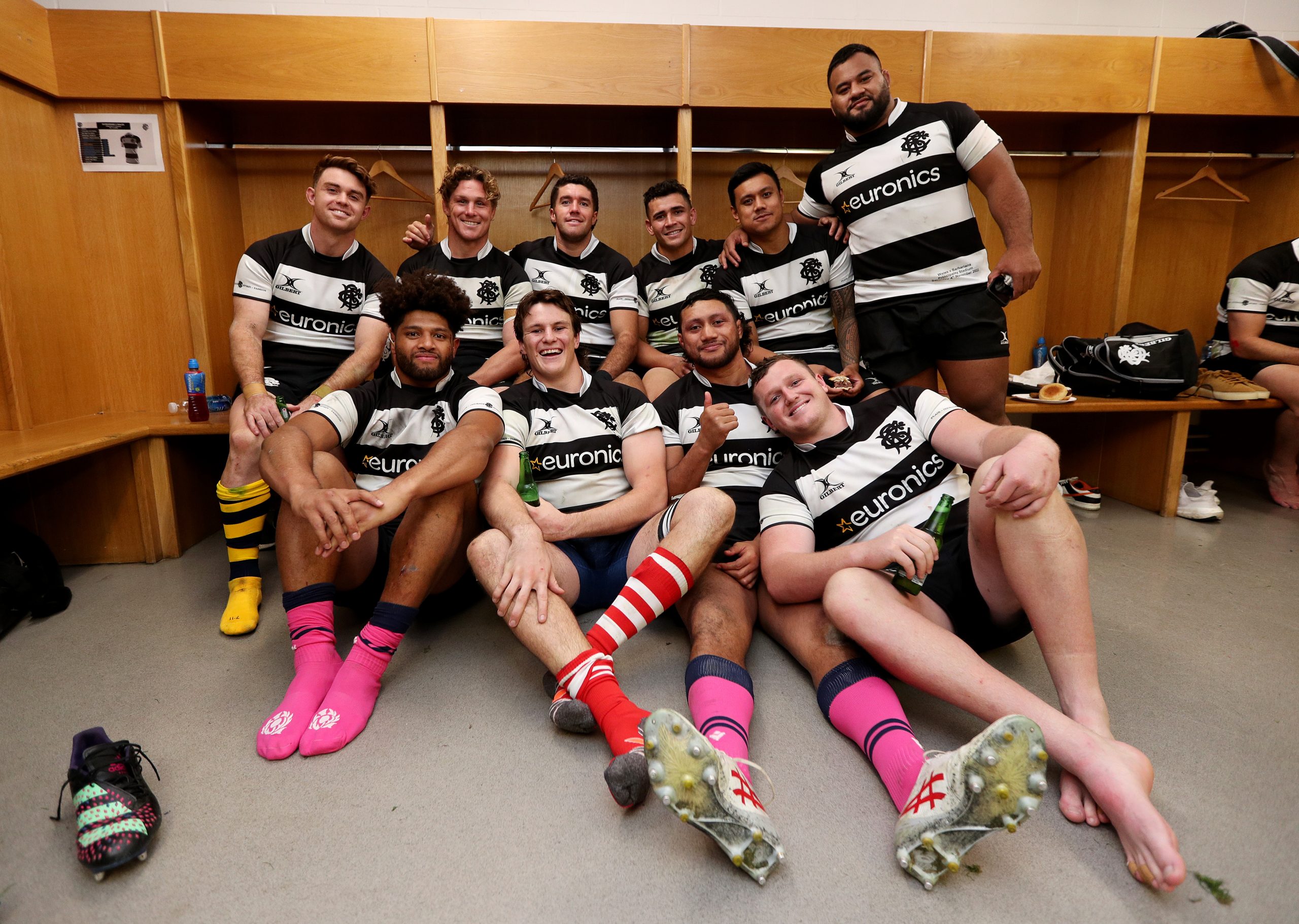 The Australian Barbarians pose for a photograph in the changing room.